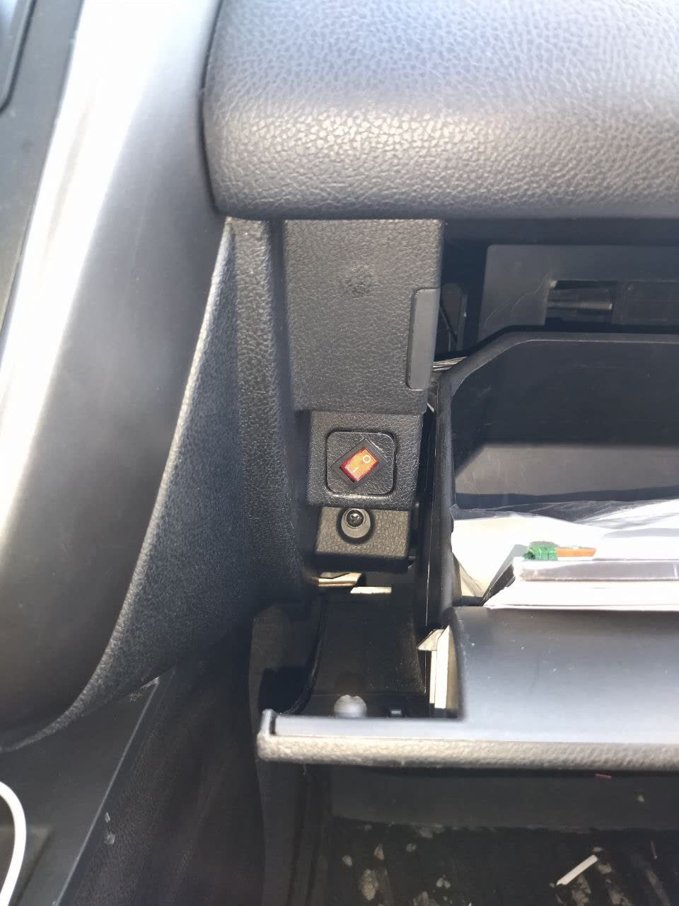 Installation photo of the toggle switch mounted in the glove-box area for manual recirculation control