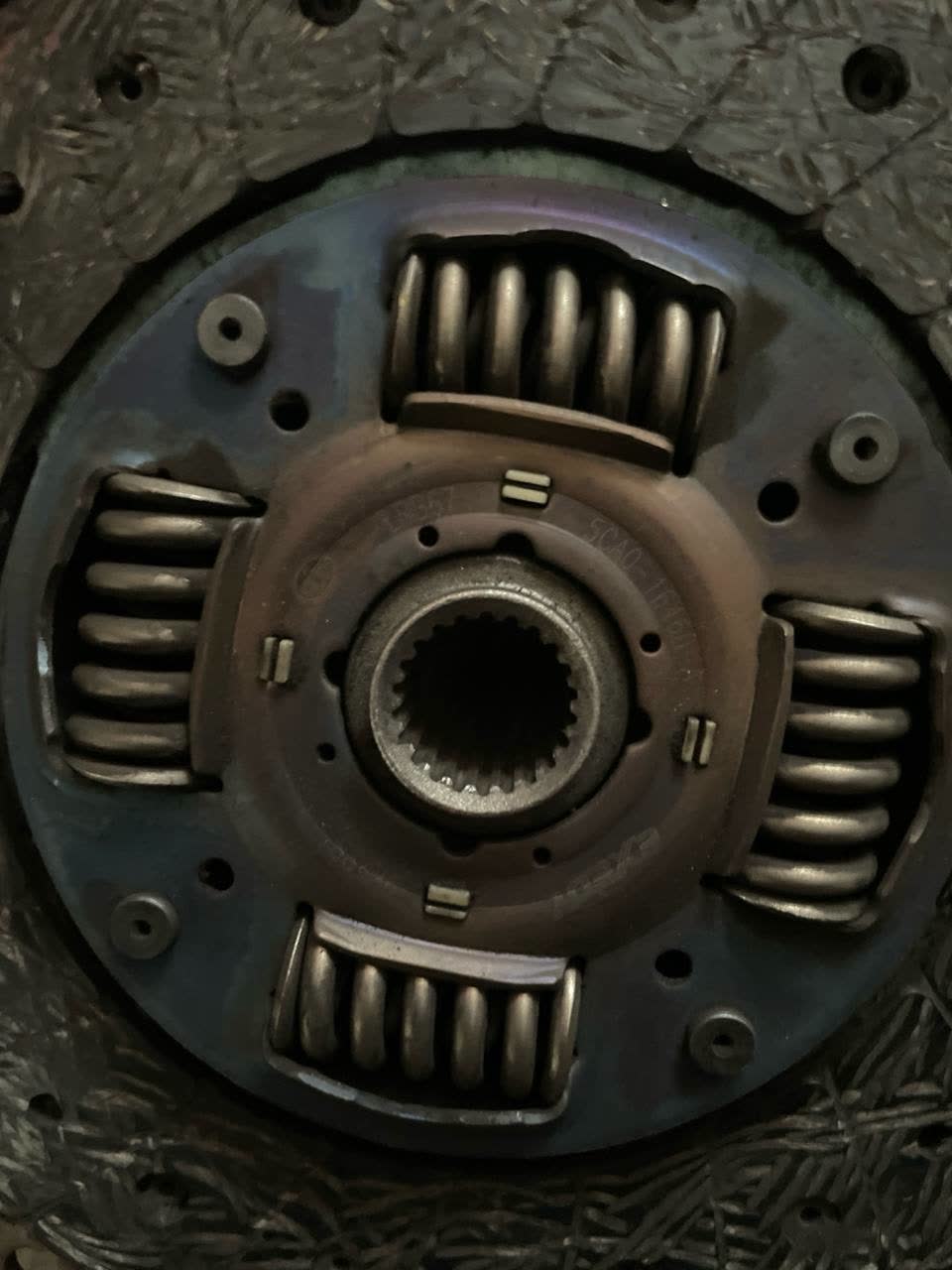 Clutch pressure plate with a stamped number that appears to read 5CA0-16410 (partly legible)