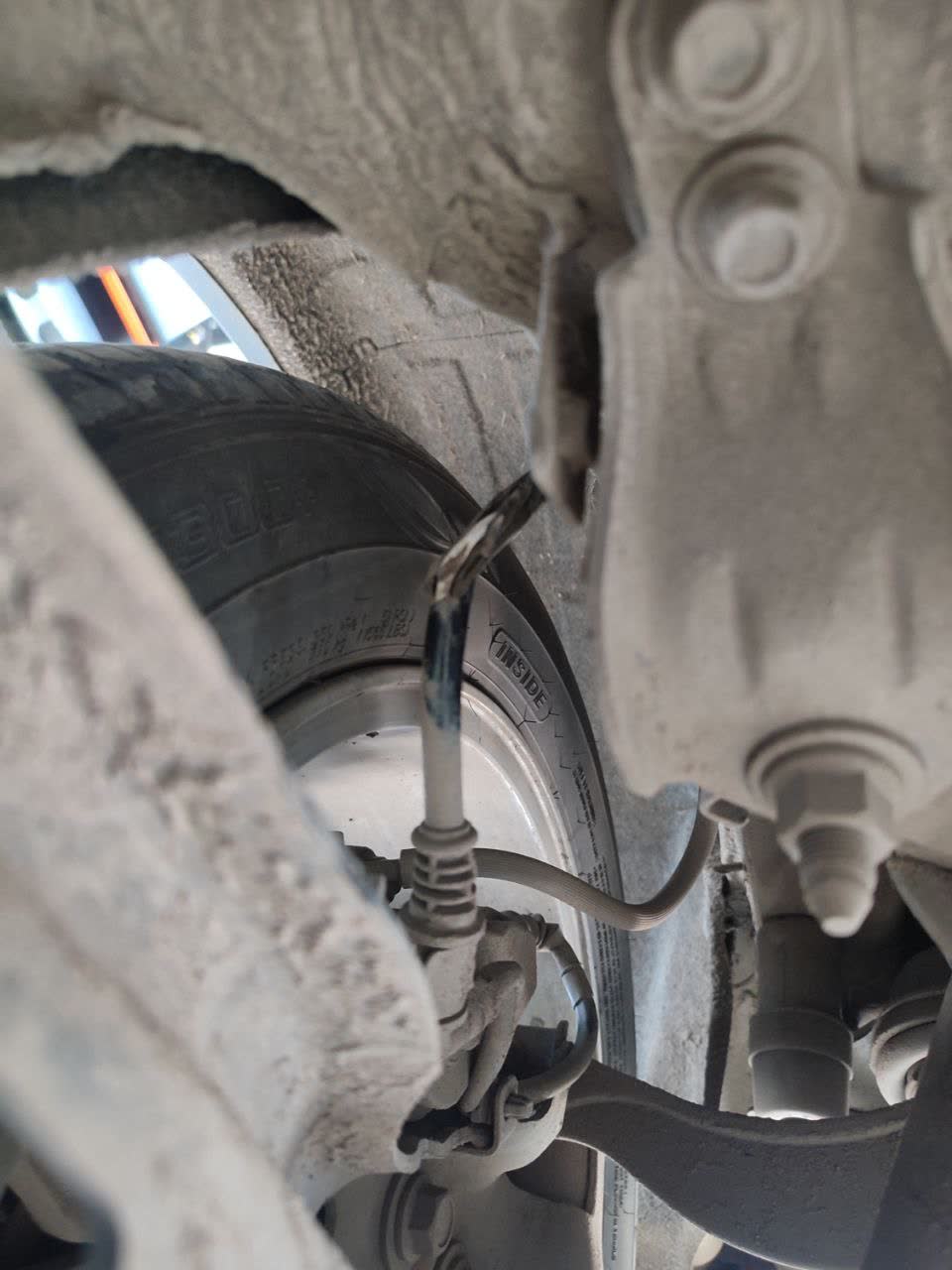 Photo of broken wire harness in engine bay after off-road use