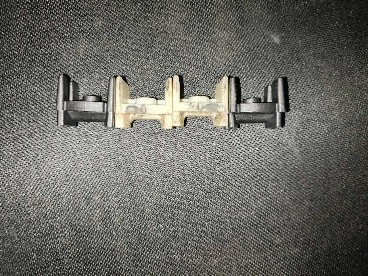 Side-by-side comparison of worn vs. new door limiter assemblies