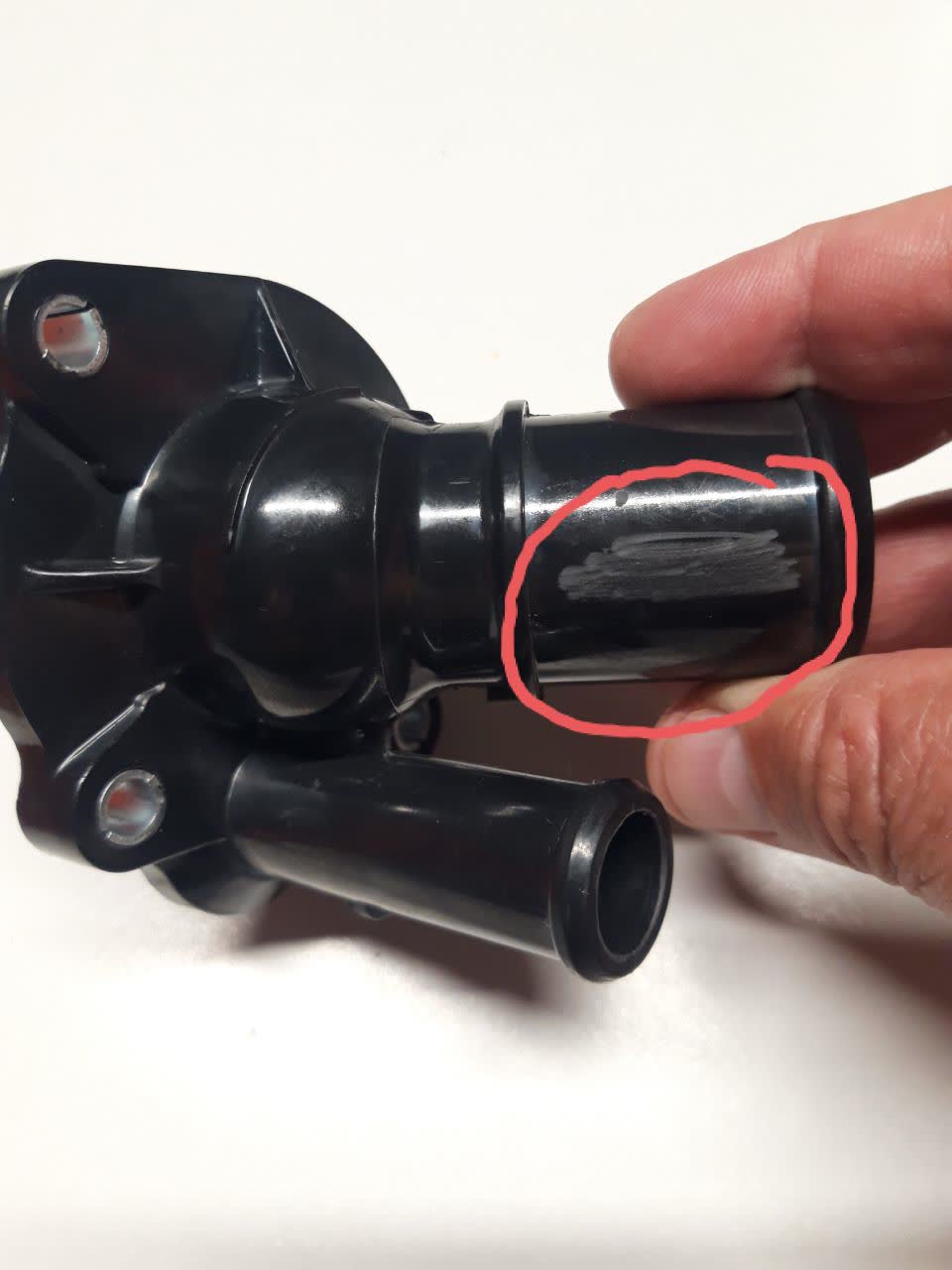 Third AliExpress thermostat, comparison angle showing housing shape and markings