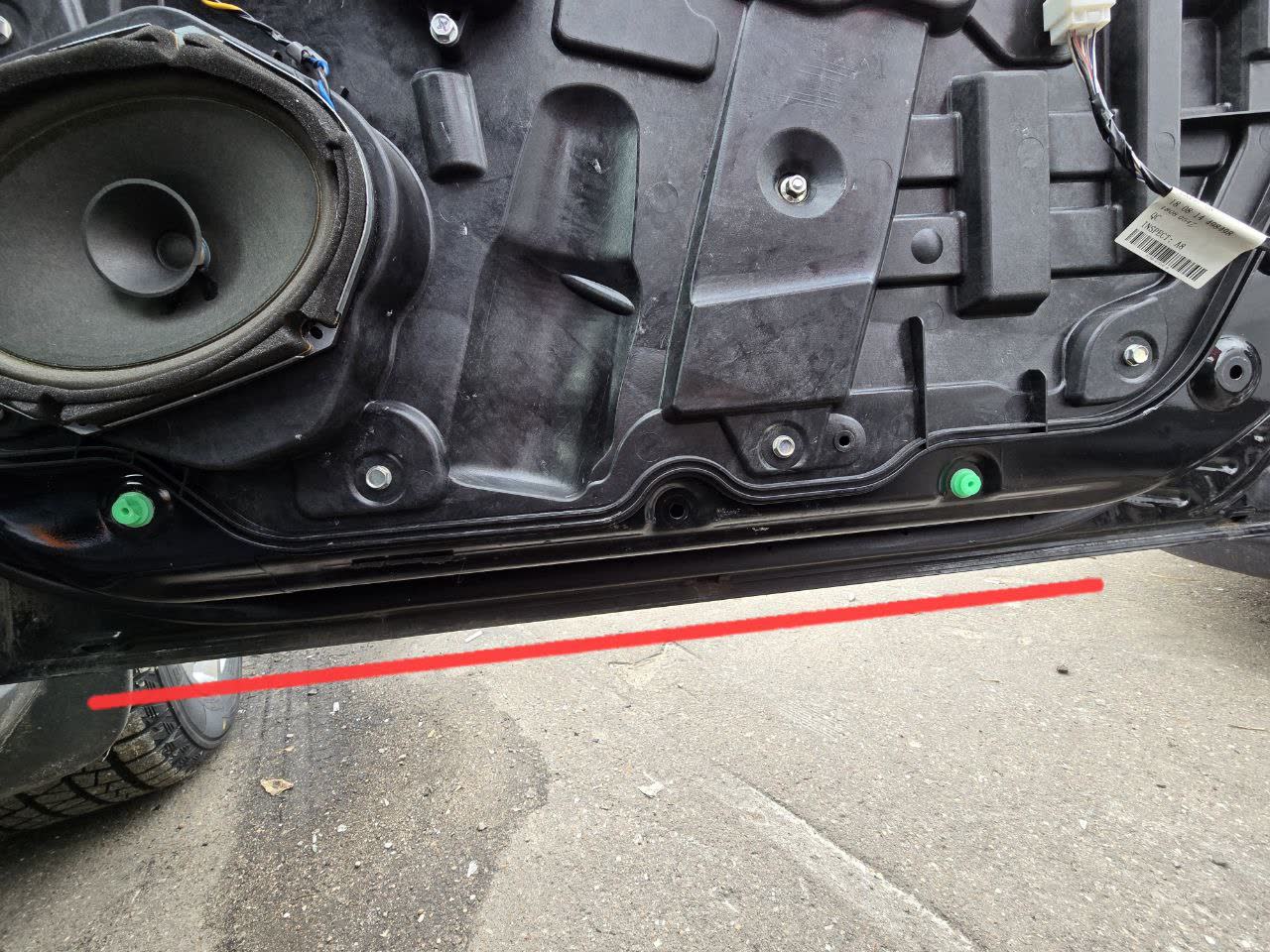 Door trim removed showing drainage areas and clip mounting points