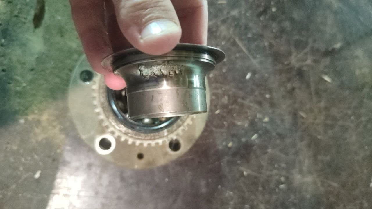 Photo of a damaged/noisy rear wheel bearing assembly