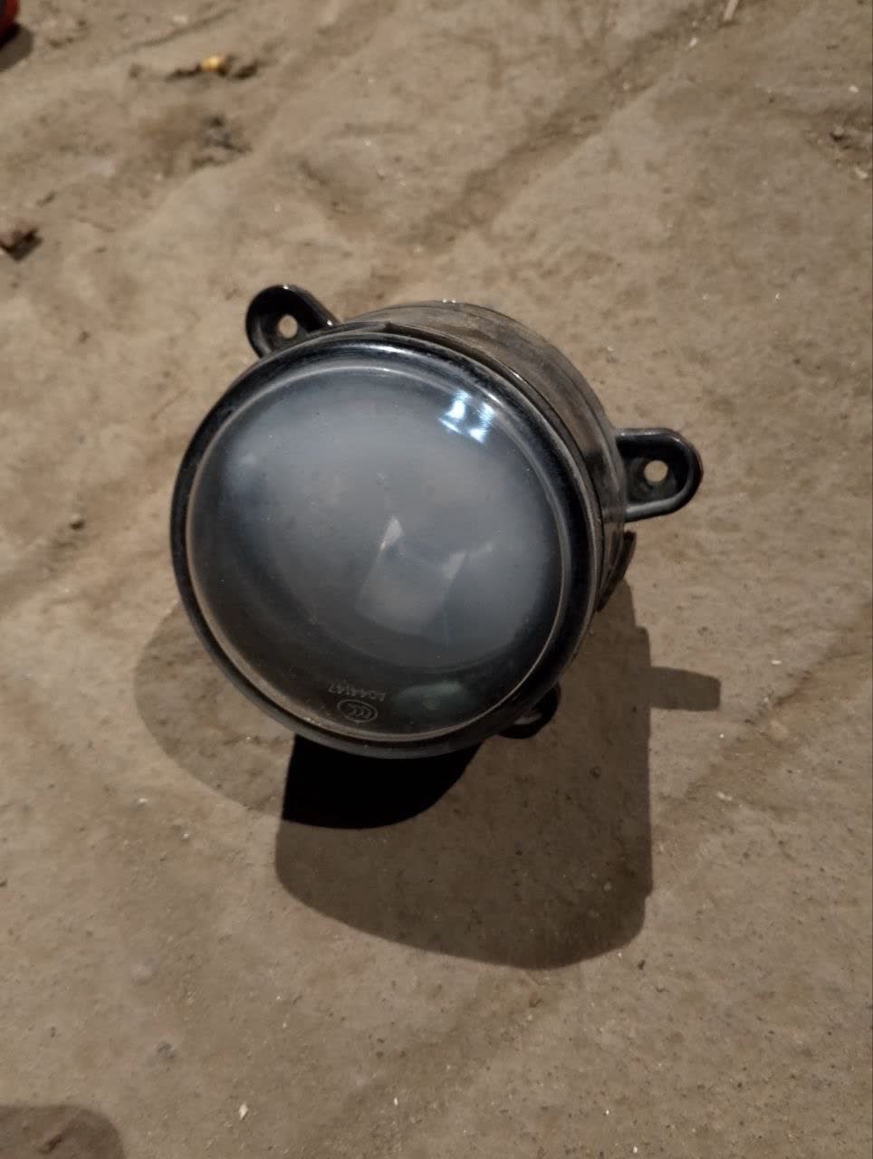 Collection of failed left fog light units documenting repeated failure pattern