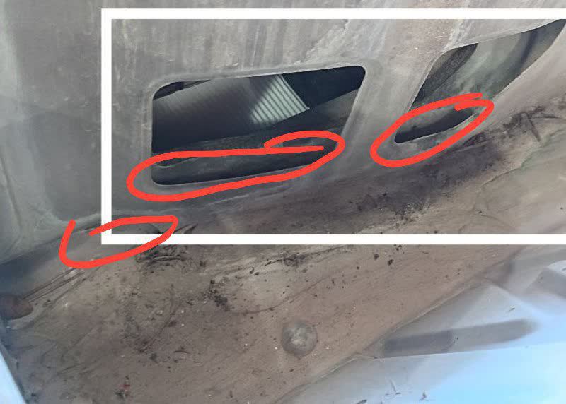 Hood drainage area marked with red circles showing the main drainage outlet and ventilation duct
