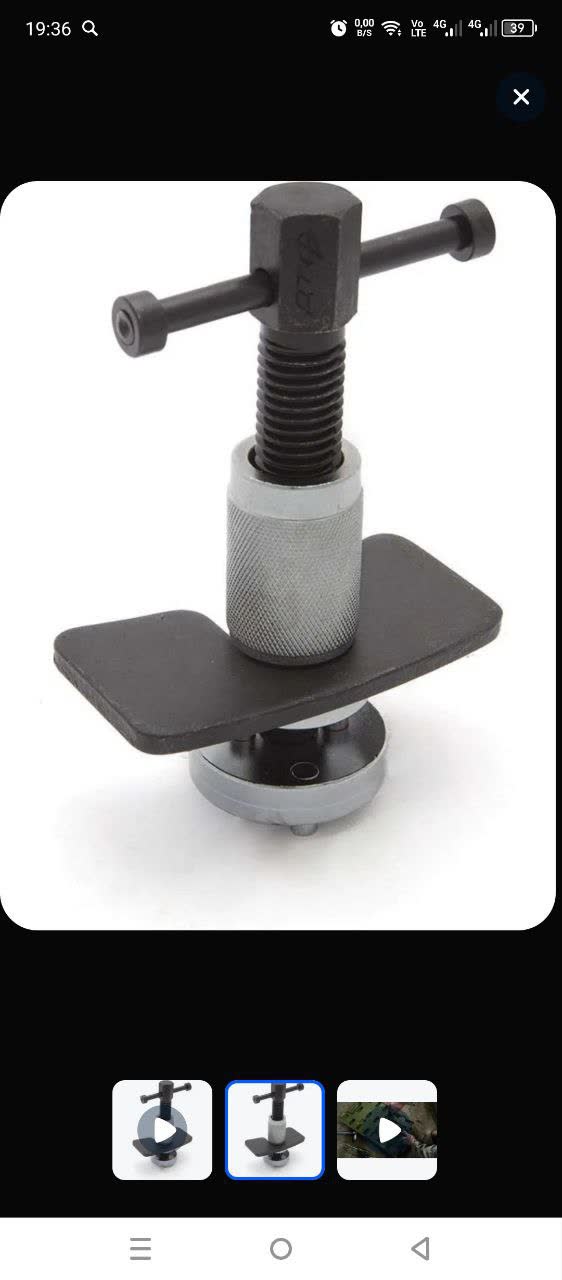 Specialized T-shaped tool with perpendicular handles and a calibrated depth-stop fixture, used to screw the rear caliper piston in to the correct depth for new pads