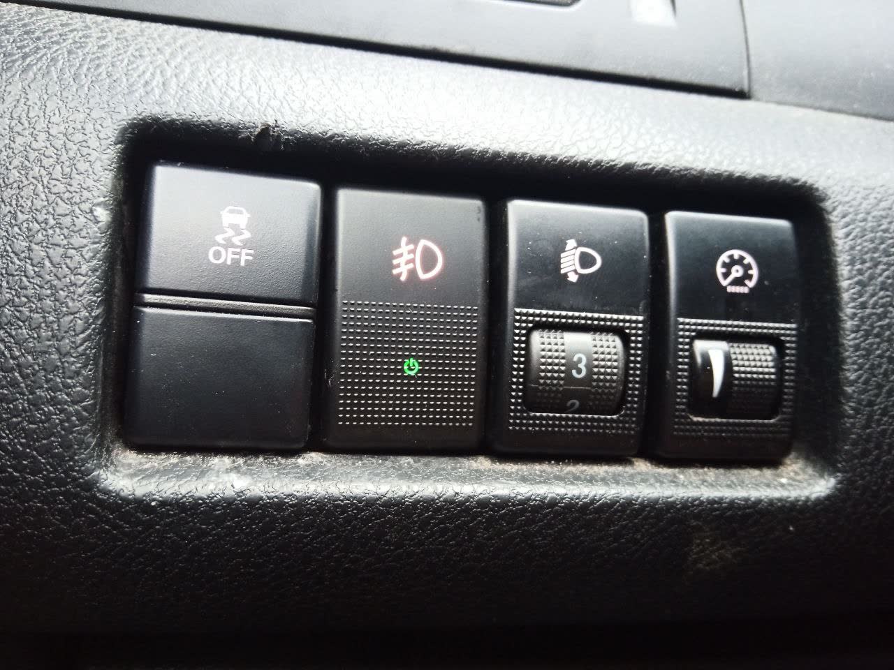 Interior control panel with the newly installed fog light switch (OFF/red/white/weather icons)
