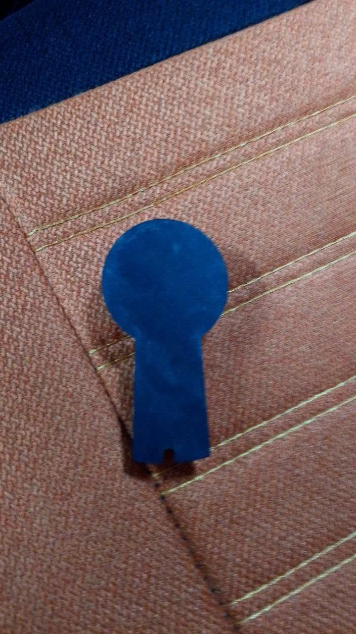 Photo of mirror housing with a marked point being confirmed as the drill location