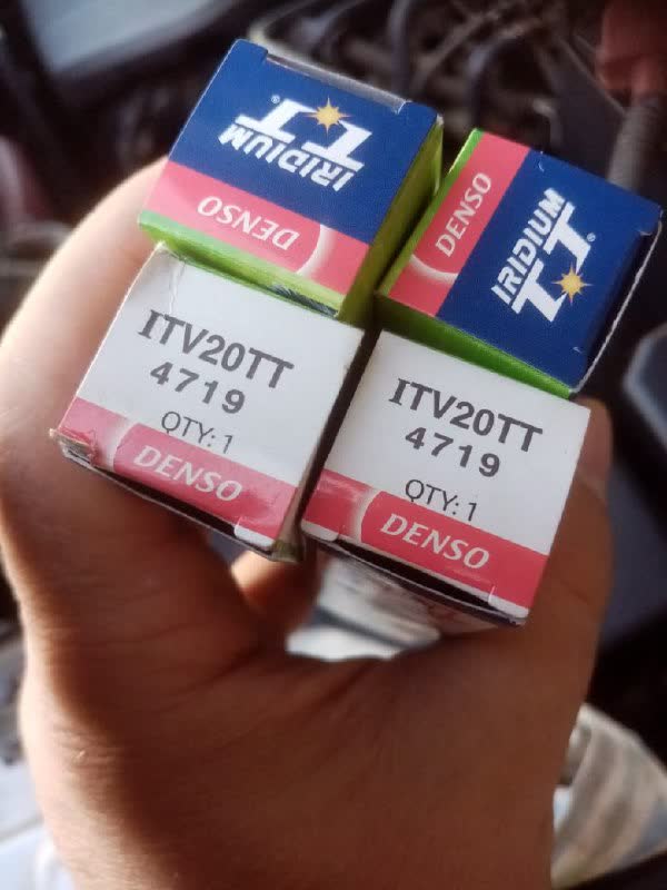 Photo of Denso spark plug boxes shown alongside Torch-brand packaging