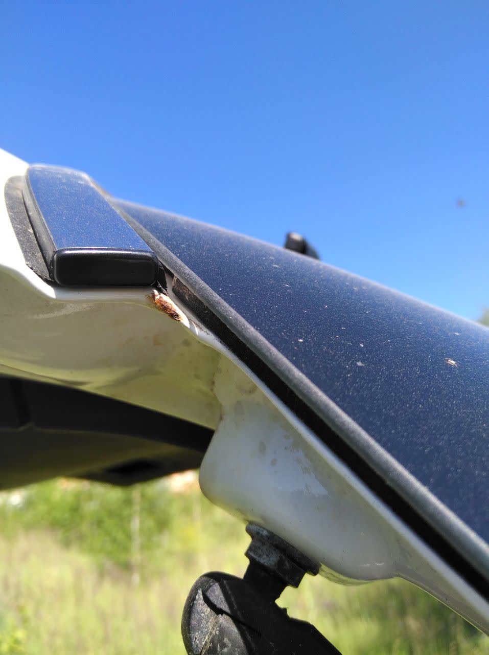 Photo of a trunk lid after anticorrosion (zinc) treatment/repair for rust