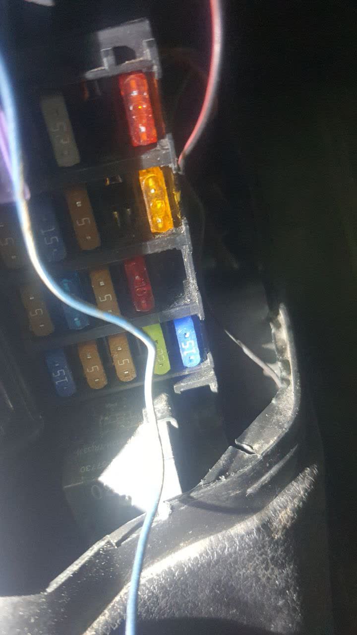 Photo of the dashboard connector area with the internal connector housing exposed/disconnected