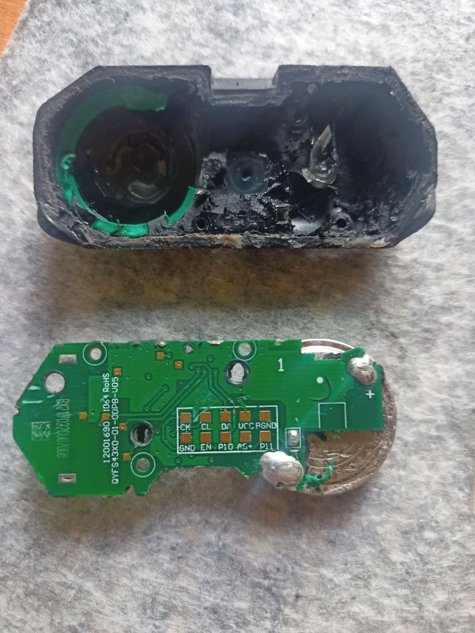 Close-up of the TPMS sensor board and battery contact pads