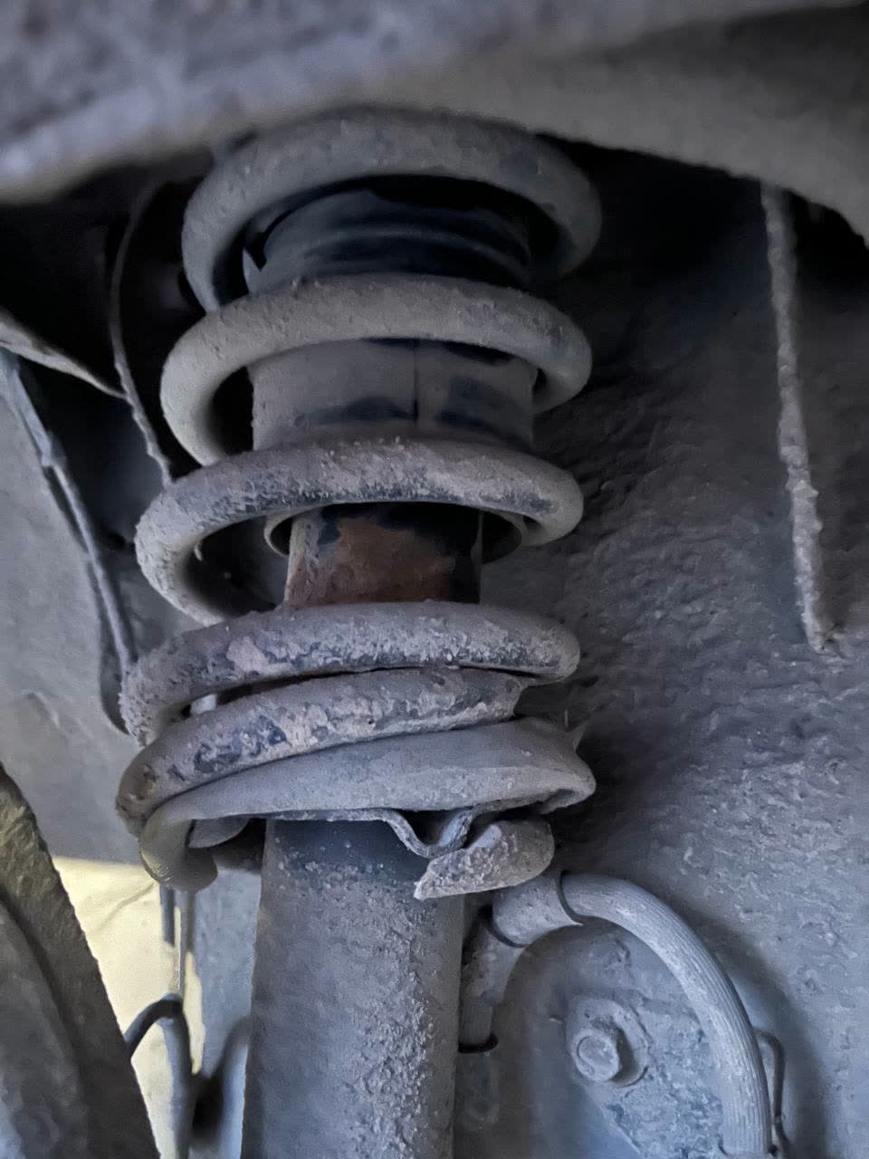 Suspension damage/wear indicators shown for reference before the Mazda-parts swap discussion