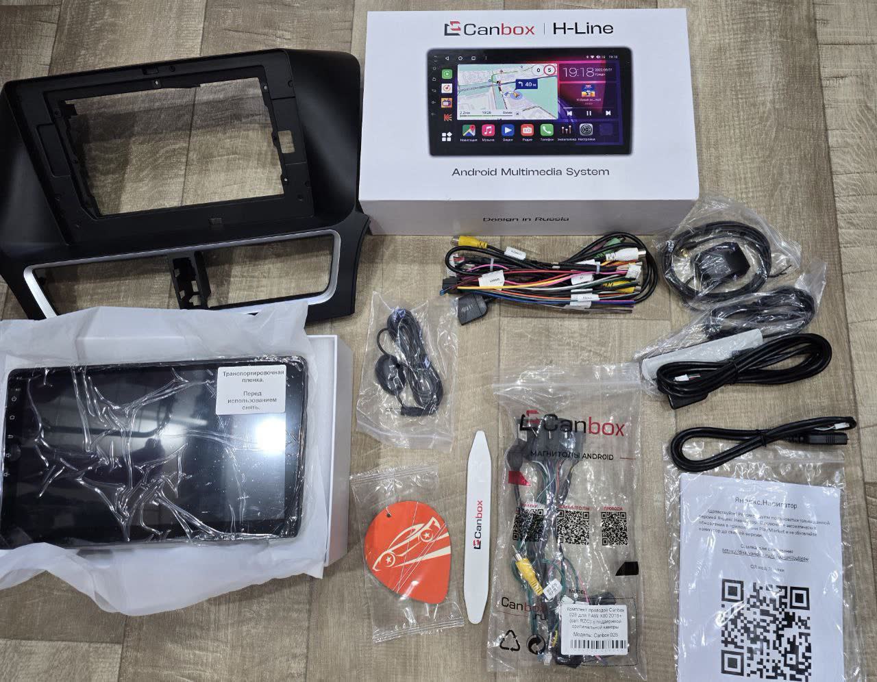Photos/video showing aftermarket head unit installation, display integration, and rear camera operation