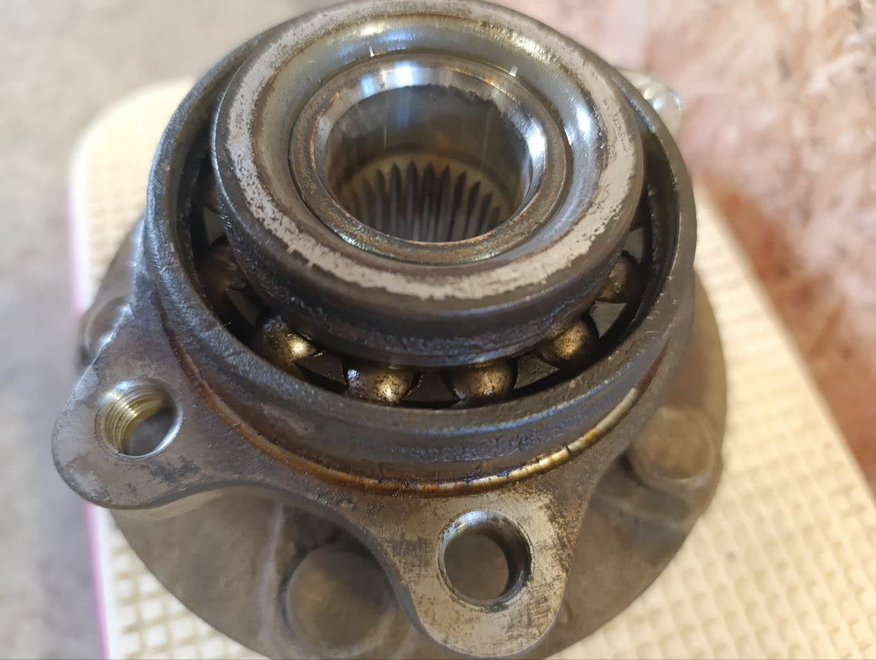 Front wheel hub bearing assembly interior shown dry (no grease) before service