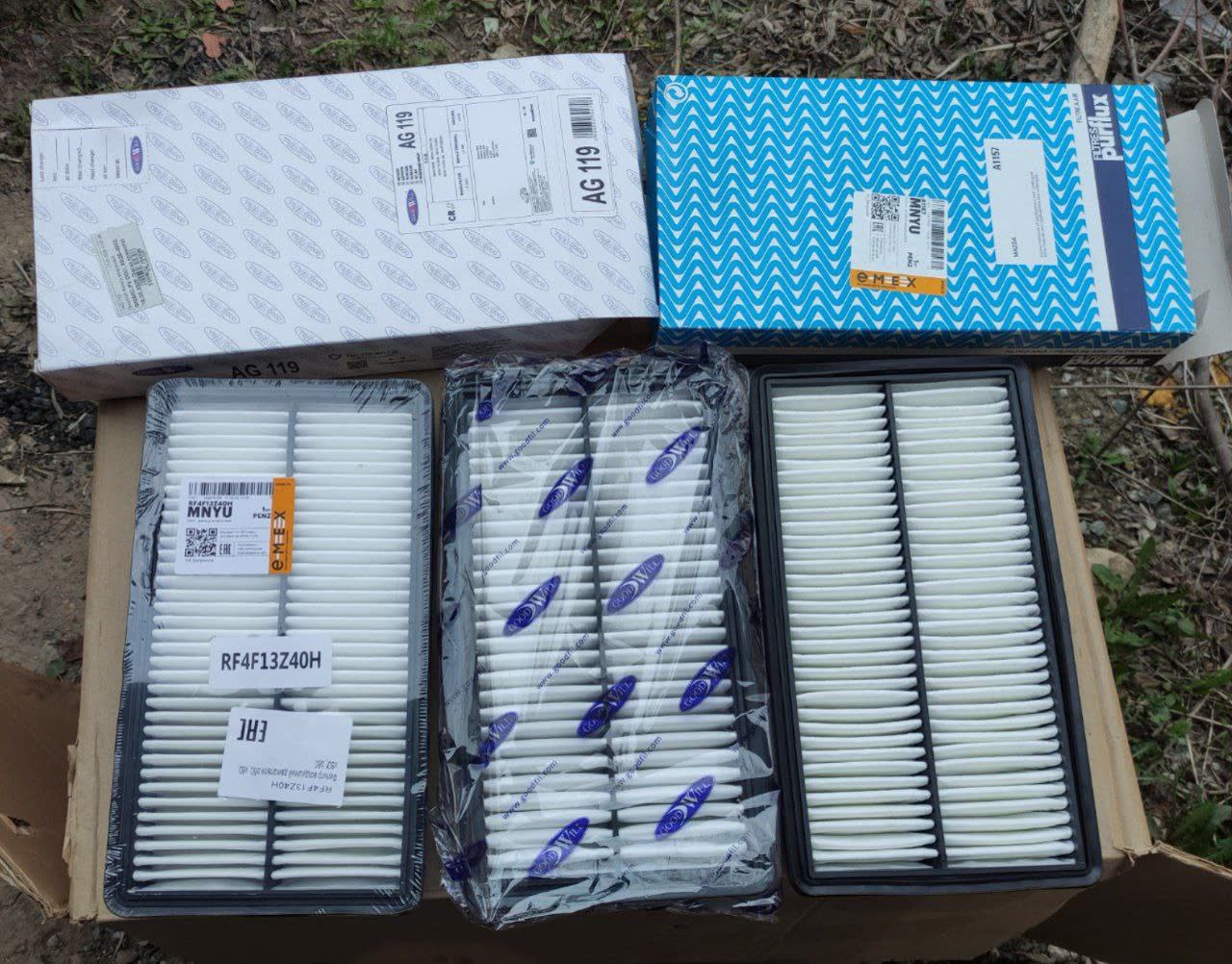 Three air filters shown side by side: Goodwill AG119 (left), original/unknown (center), Purflux A 1157 (right), in their packaging