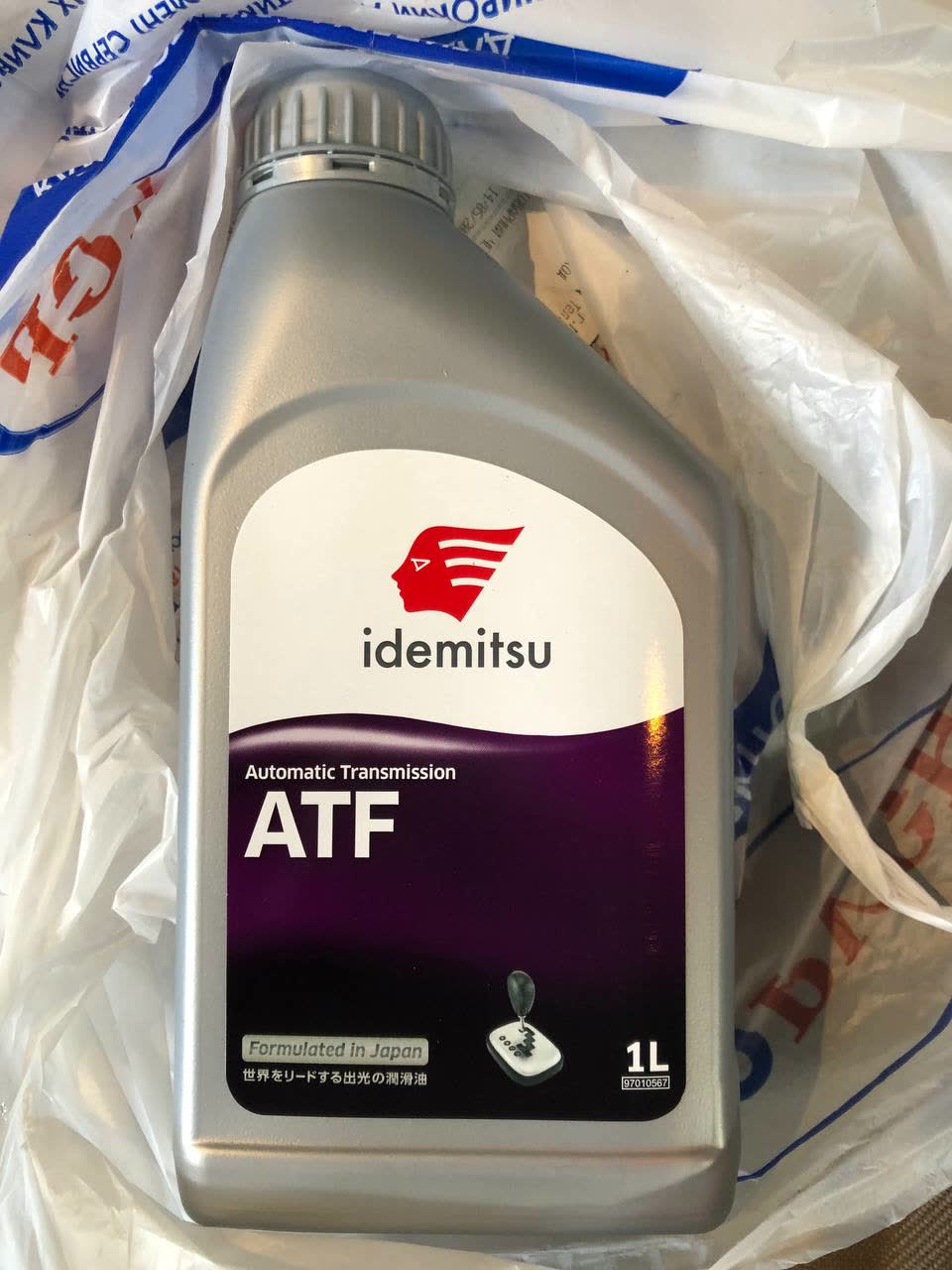Photo of MANNOL MULTIVEHICLE JWS 3309 fluid bottle with specification label