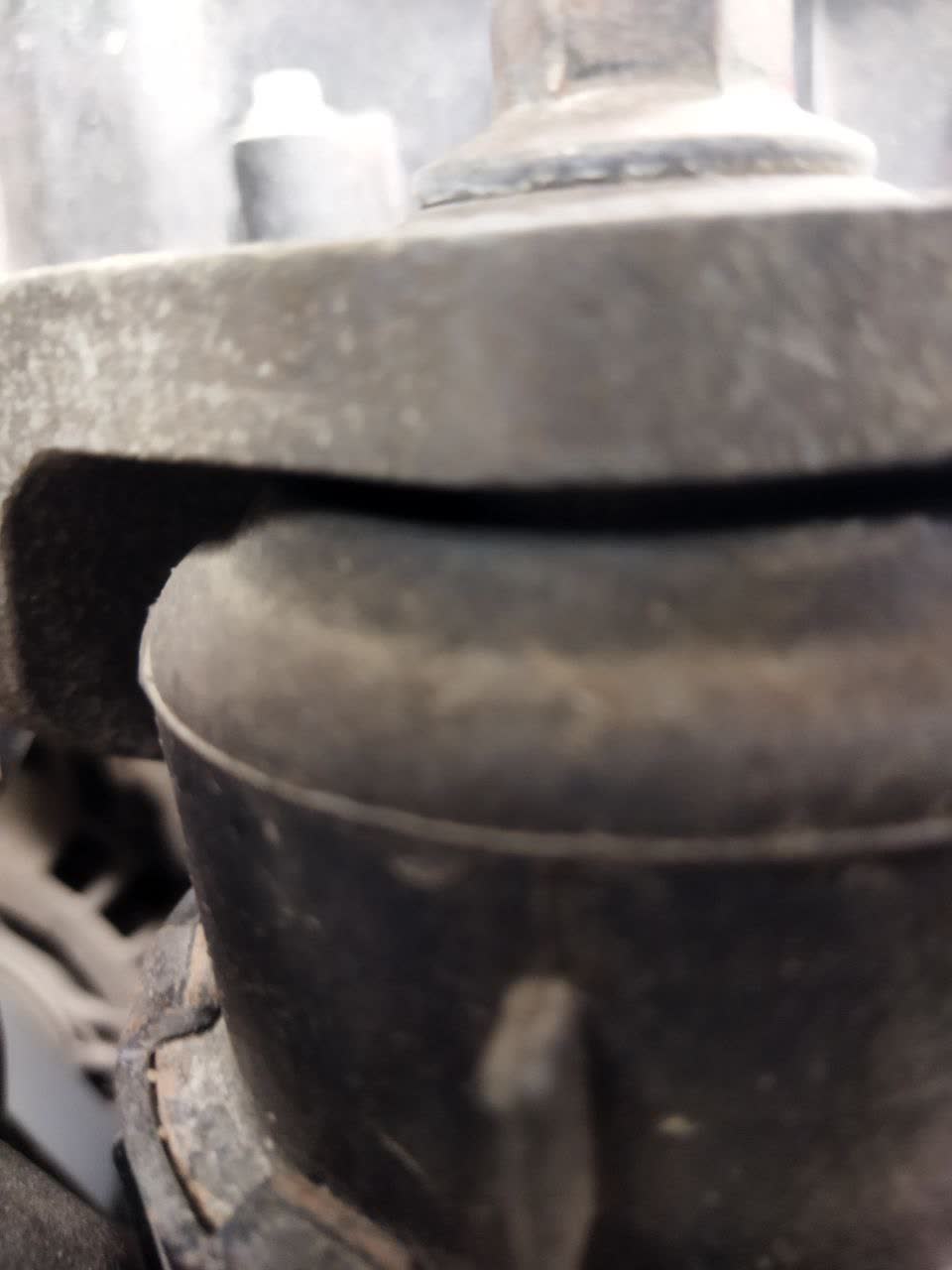 Photo of a Patron PSE3325 engine mount rubber damper compared against an OEM mount