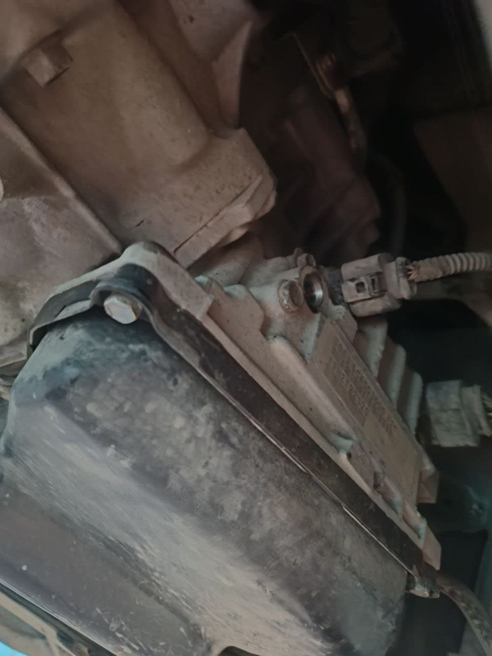 Transmission pan area and drain plug location during a partial fluid exchange