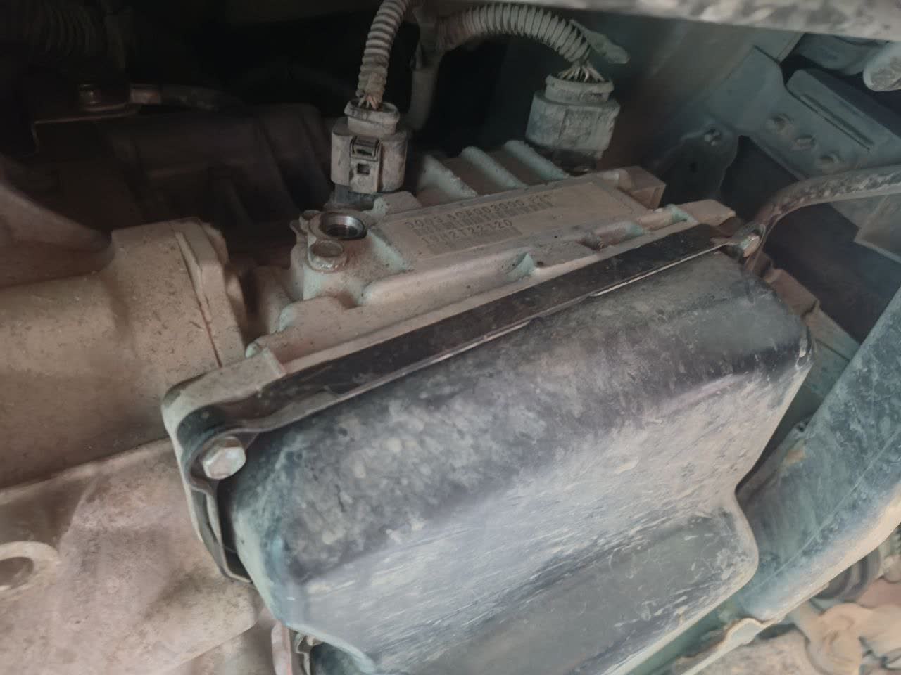 Top filler connection near the heat exchanger used for refilling AKPP fluid