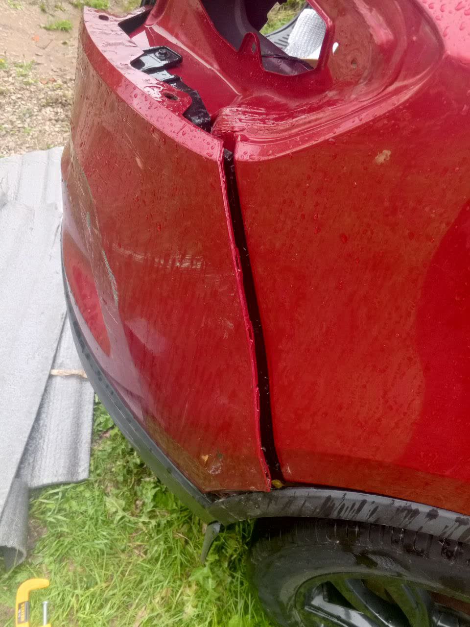 Rear fog light assembly removed, showing connector