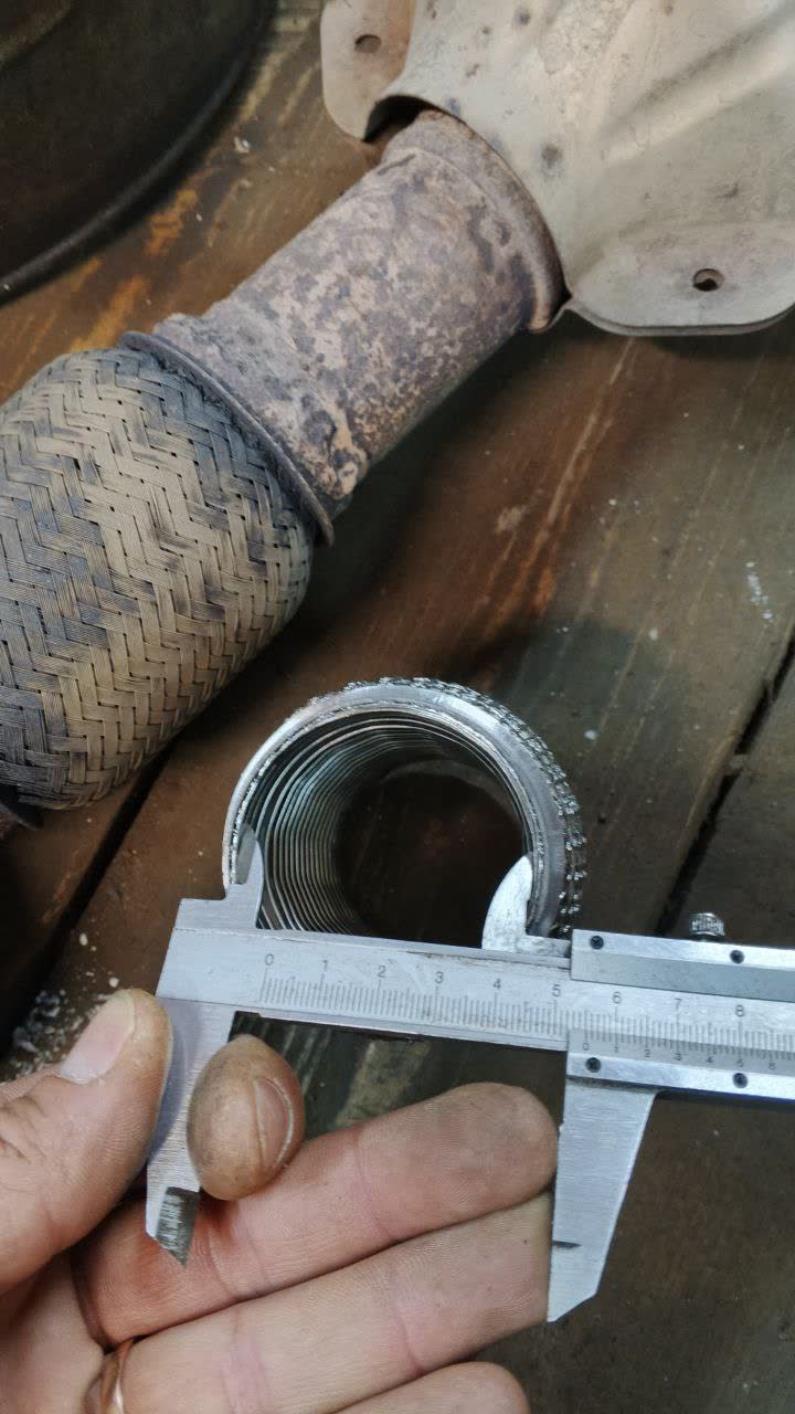 Hose removed, showing installation complexity around nearby components