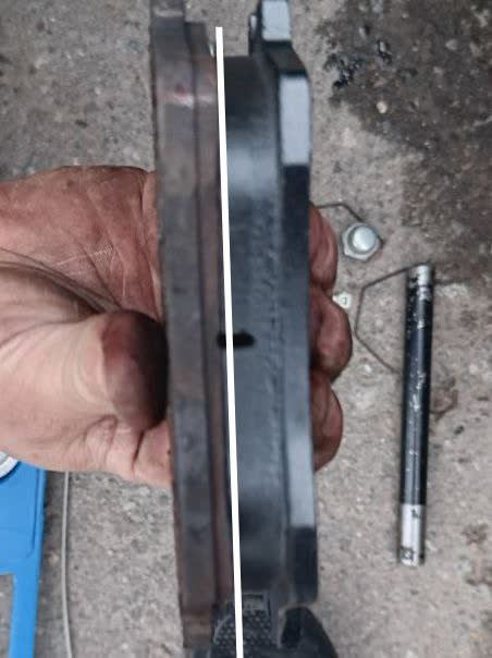Close-up photo showing uneven/hollow wear pattern across the Mytishchi pad face, clarifying it is pad wear rather than a warped rotor