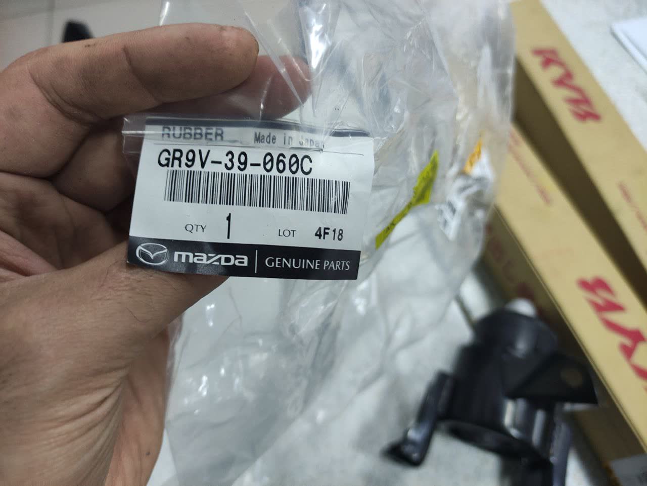 OEM engine support packaging with a stapled label vs. expected original packaging