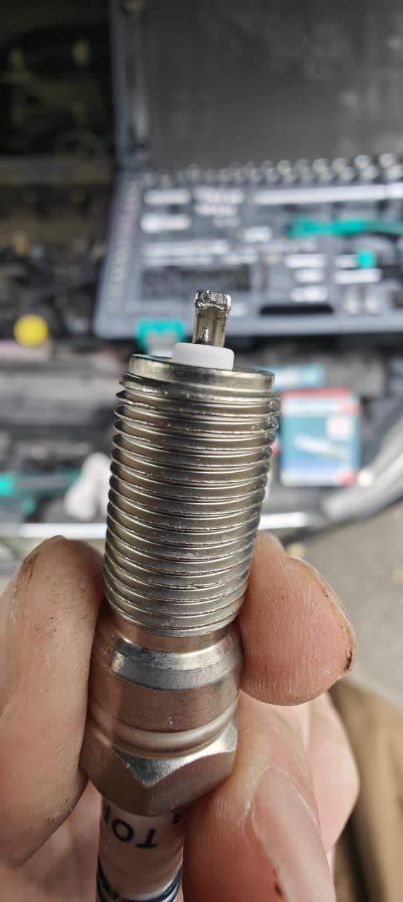 TORCH spark plug close-up showing electrode
