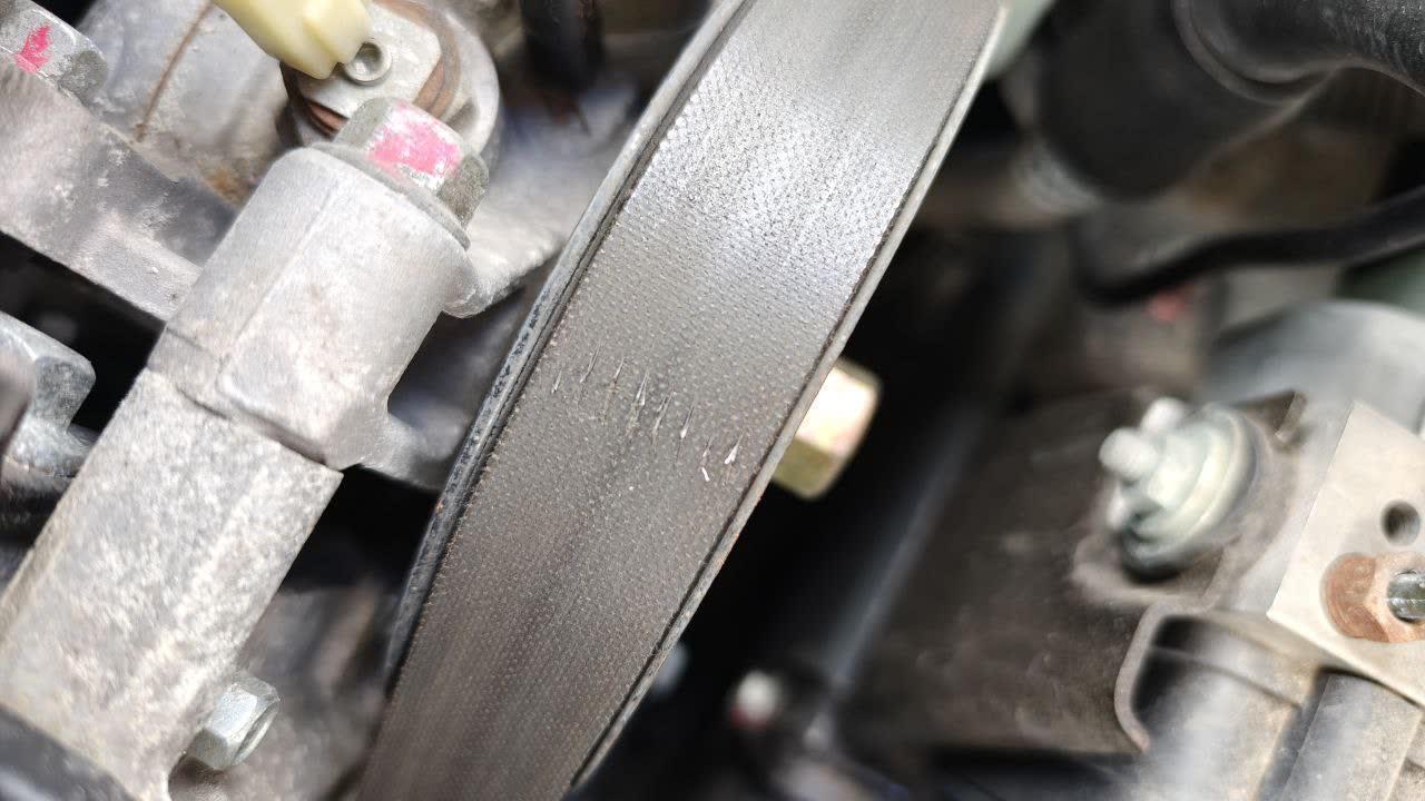 Belt wear pattern shown at 65,000 km
