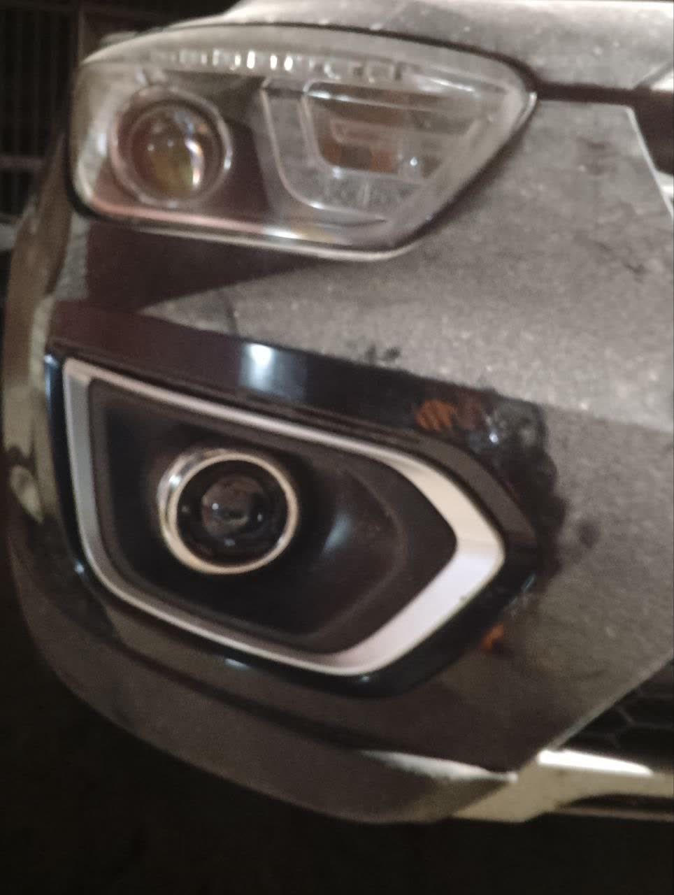 Photo of installed BI-LED module on vehicle showing beam pattern