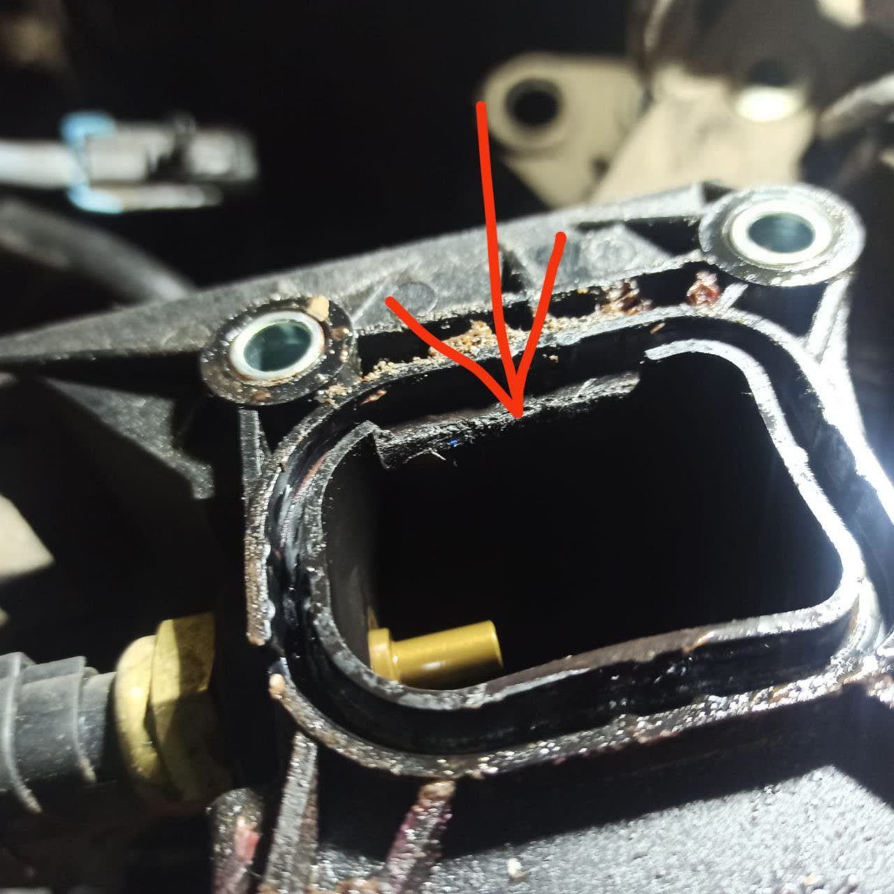 Photo of the cooling-jacket body near the temperature-sensor location where the siphon hose connects