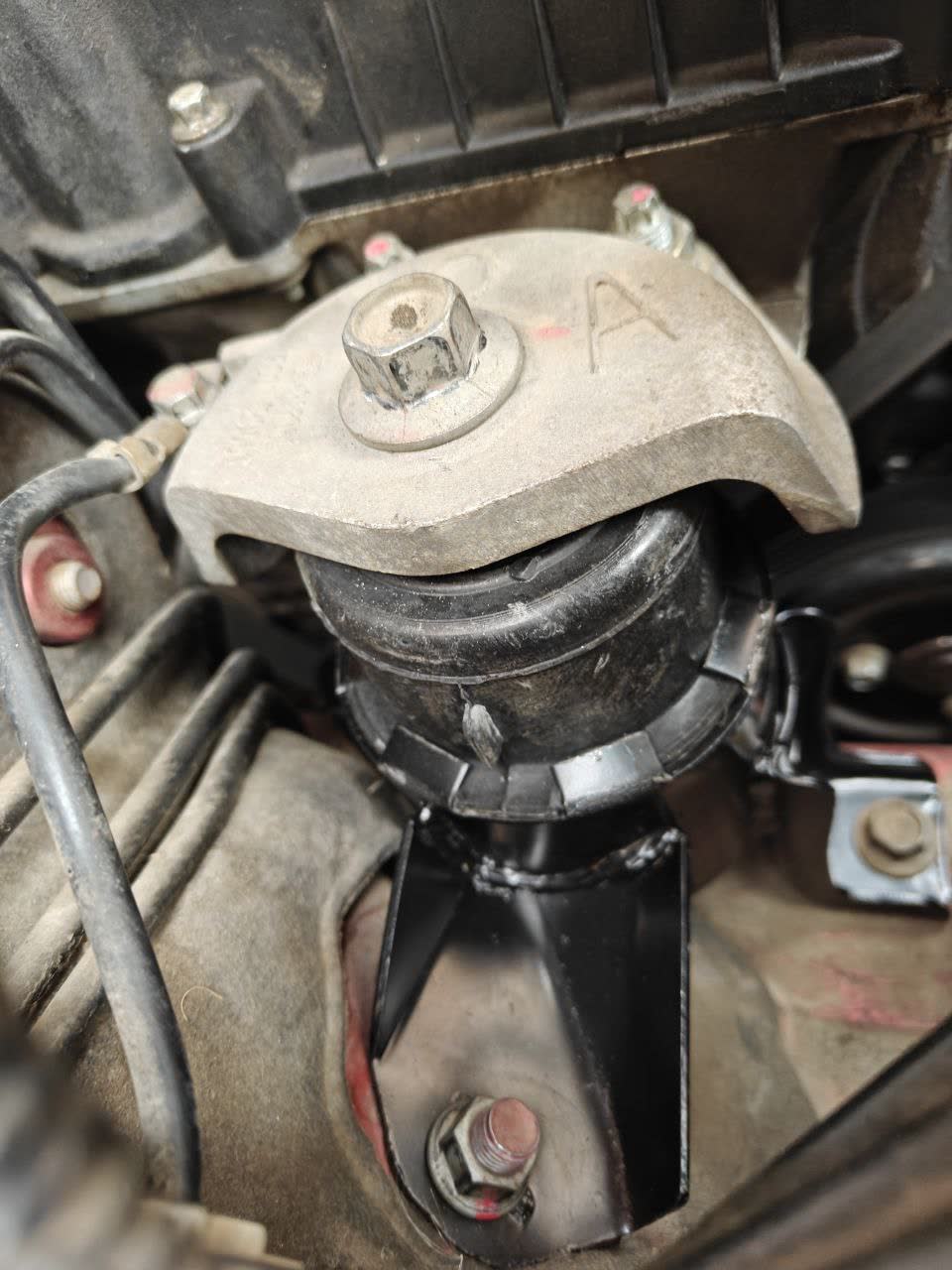 Installed Torque AS1111 engine mount with installation bolt detail
