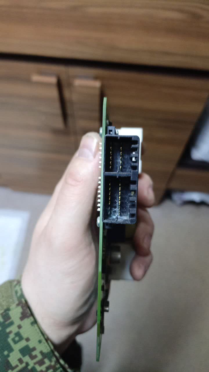 Close-up showing green oxidation on BCM contacts requiring cleaning