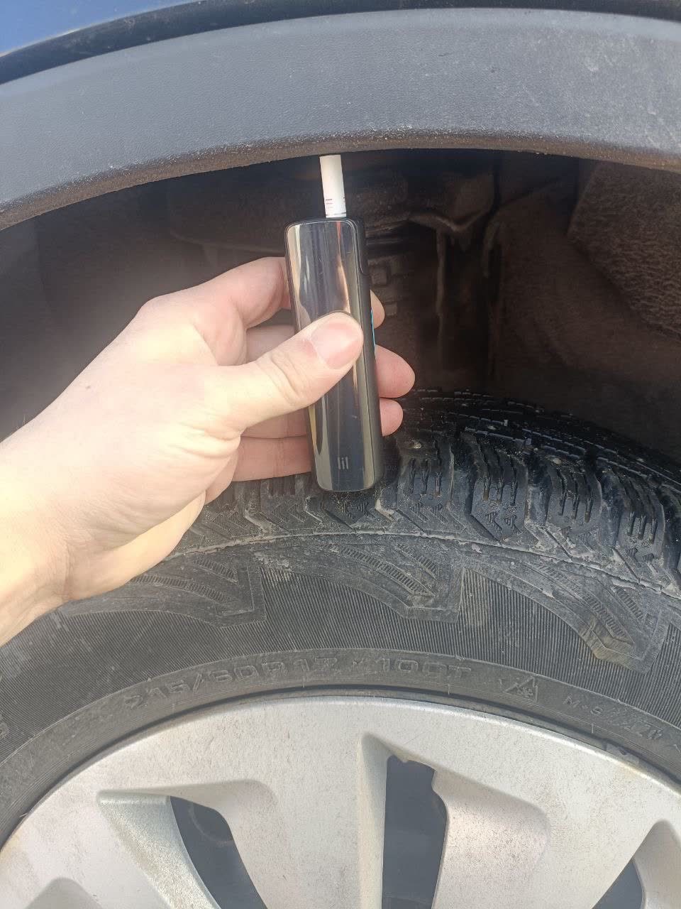 Second measurement photo of the raised front end after new front spring installation