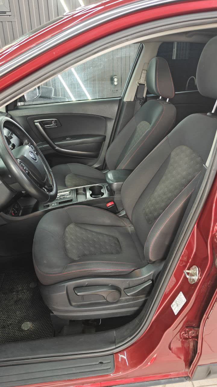 Before photo: original grey fabric seats prior to the custom leather cover install