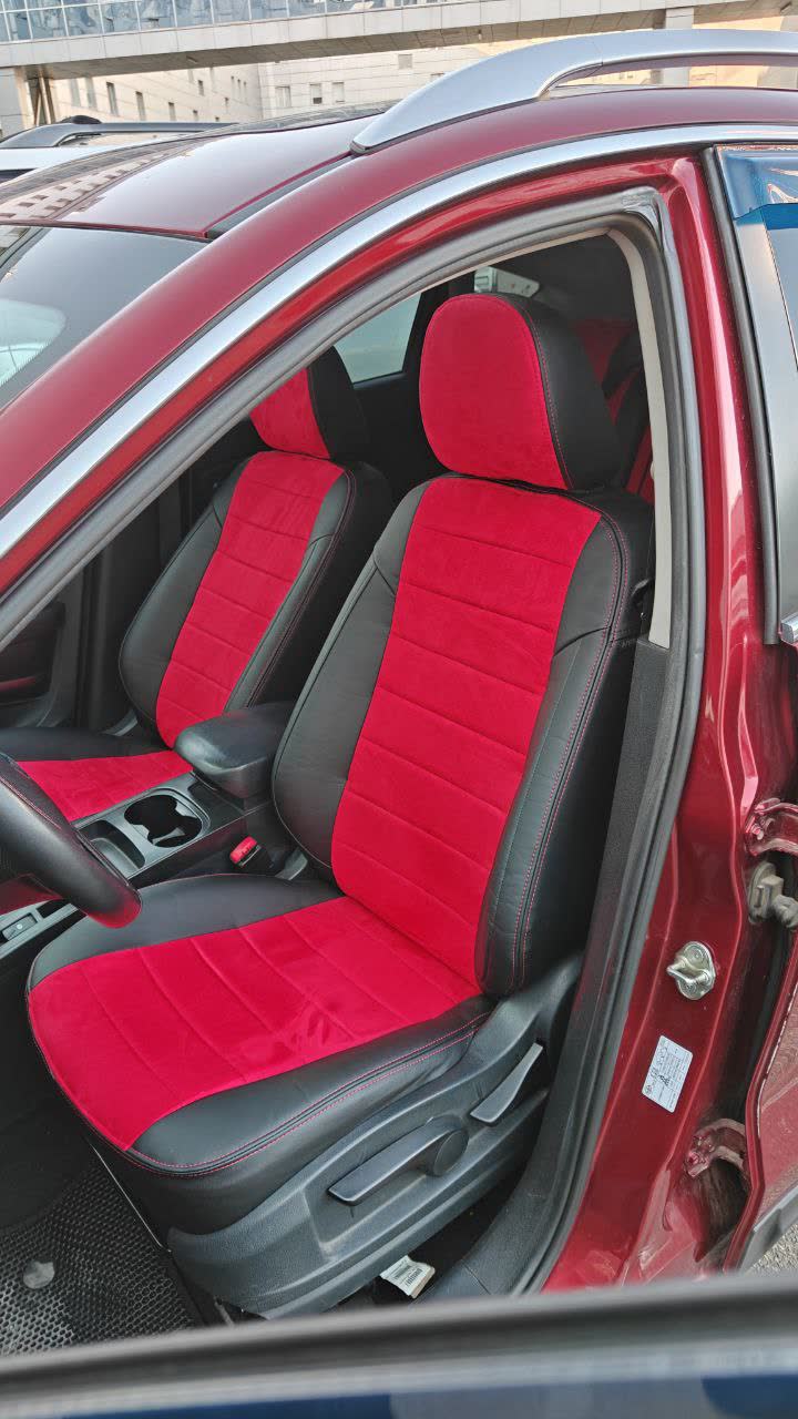 After photo: rear seat coverage with the same red leather/black trim treatment, reinforced padding visible