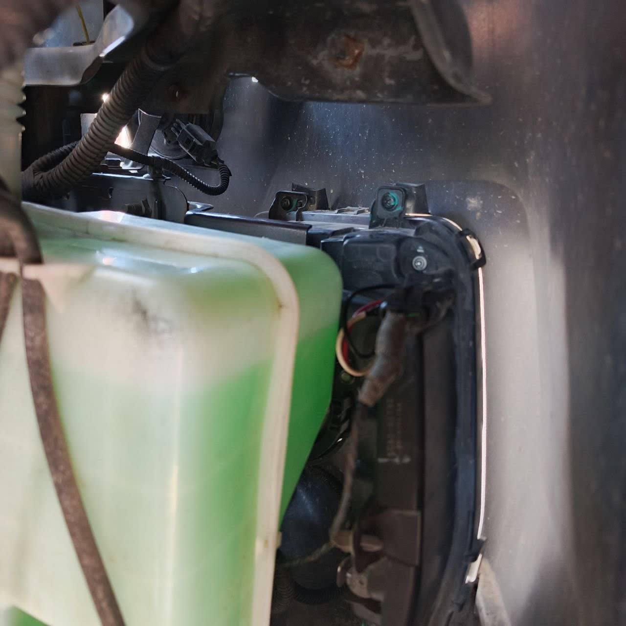 Harness routing through the undercarriage toward the DRL unit