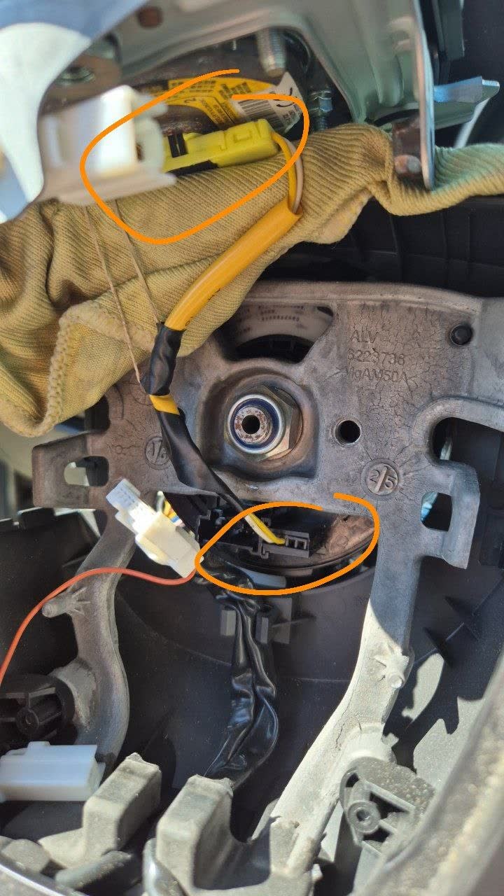 Photo of the connector showing yellow fixator pieces before disassembly