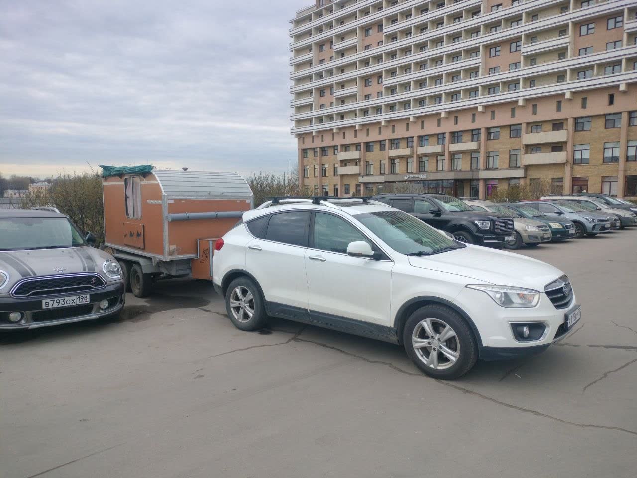 The tow hitch shown coupled with an attached trailer