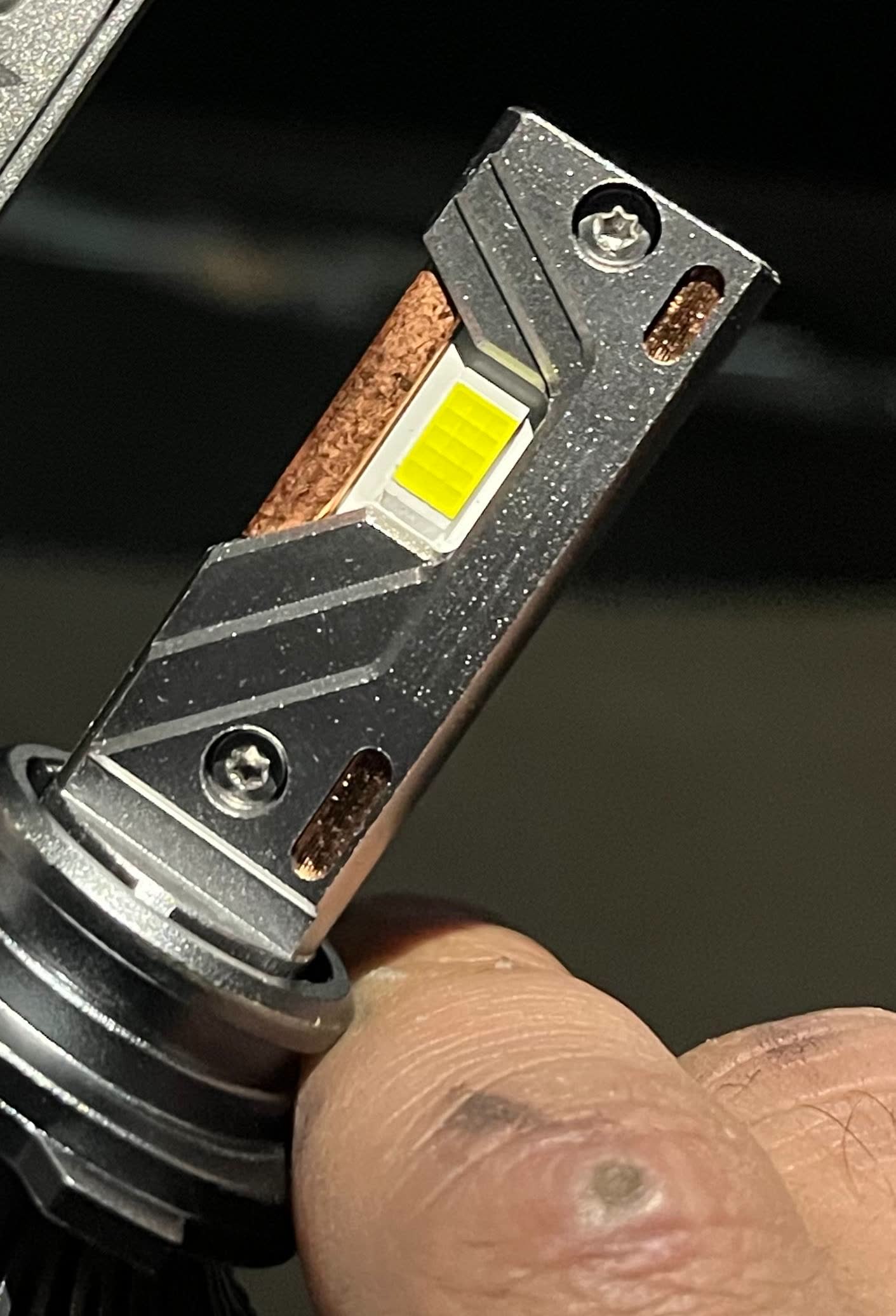 LED headlight bulb showing bright light emission compared to stock