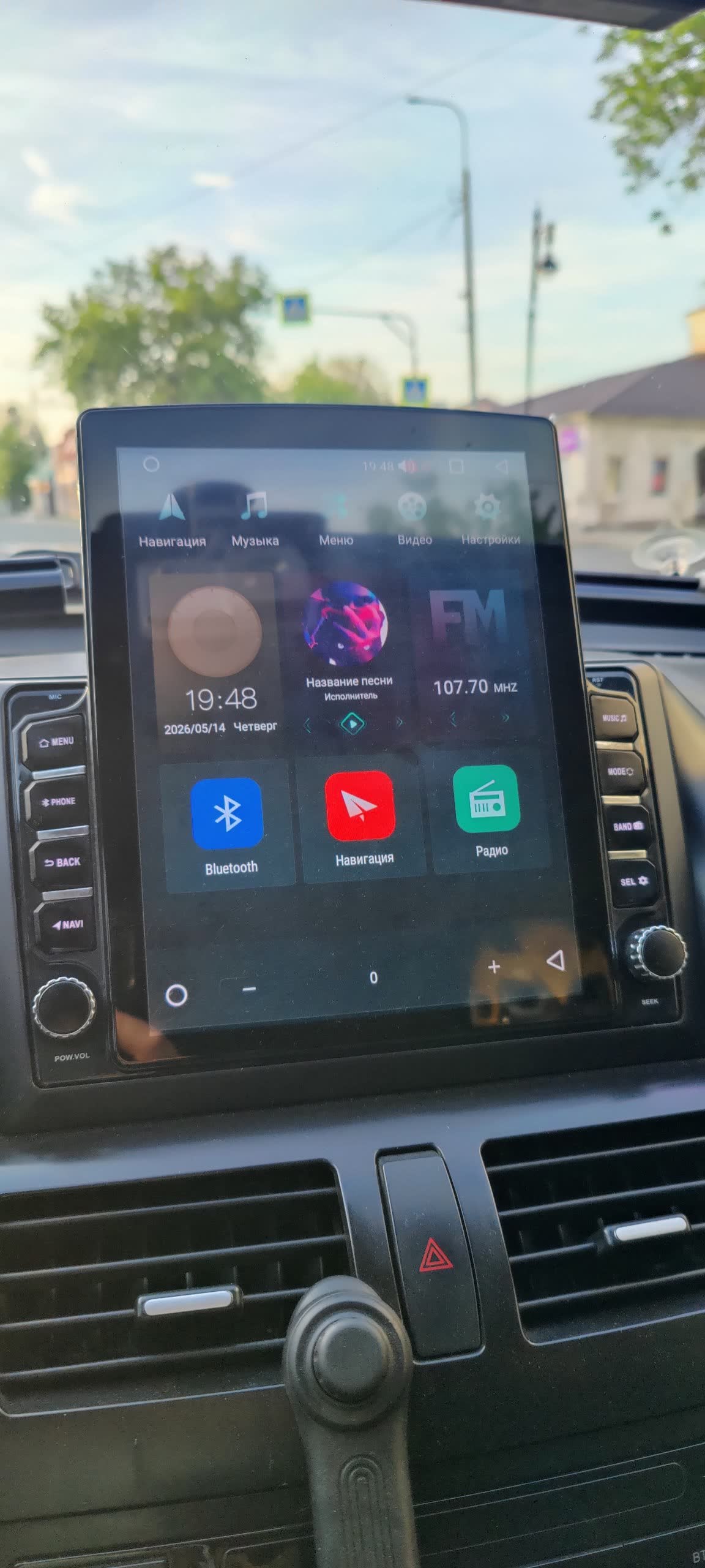 Photo of the Tesla-style touchscreen unit installed in the X80
