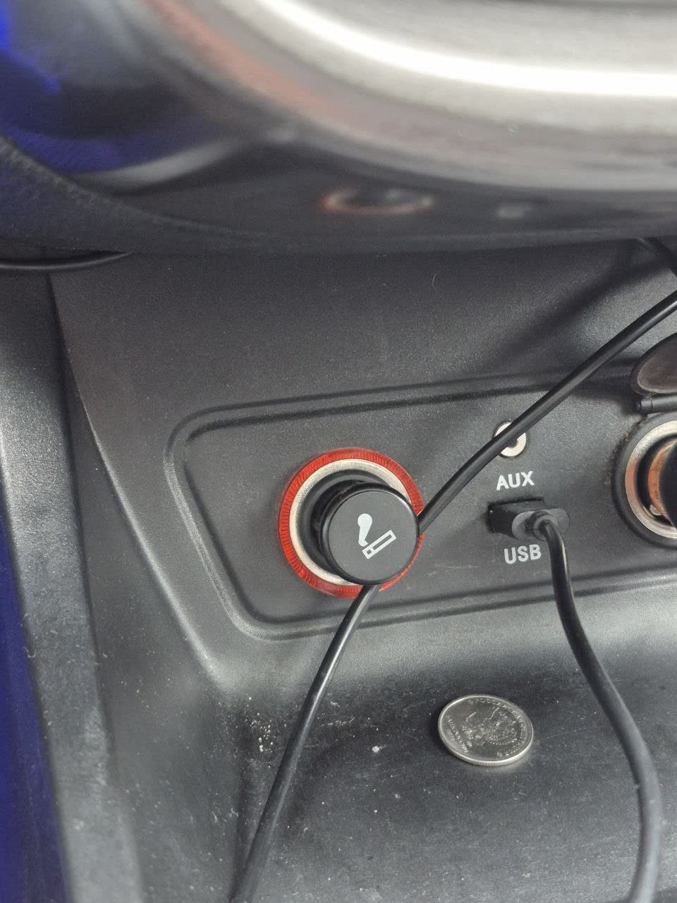 Photo of the cigarette lighter/power socket area on the dashboard