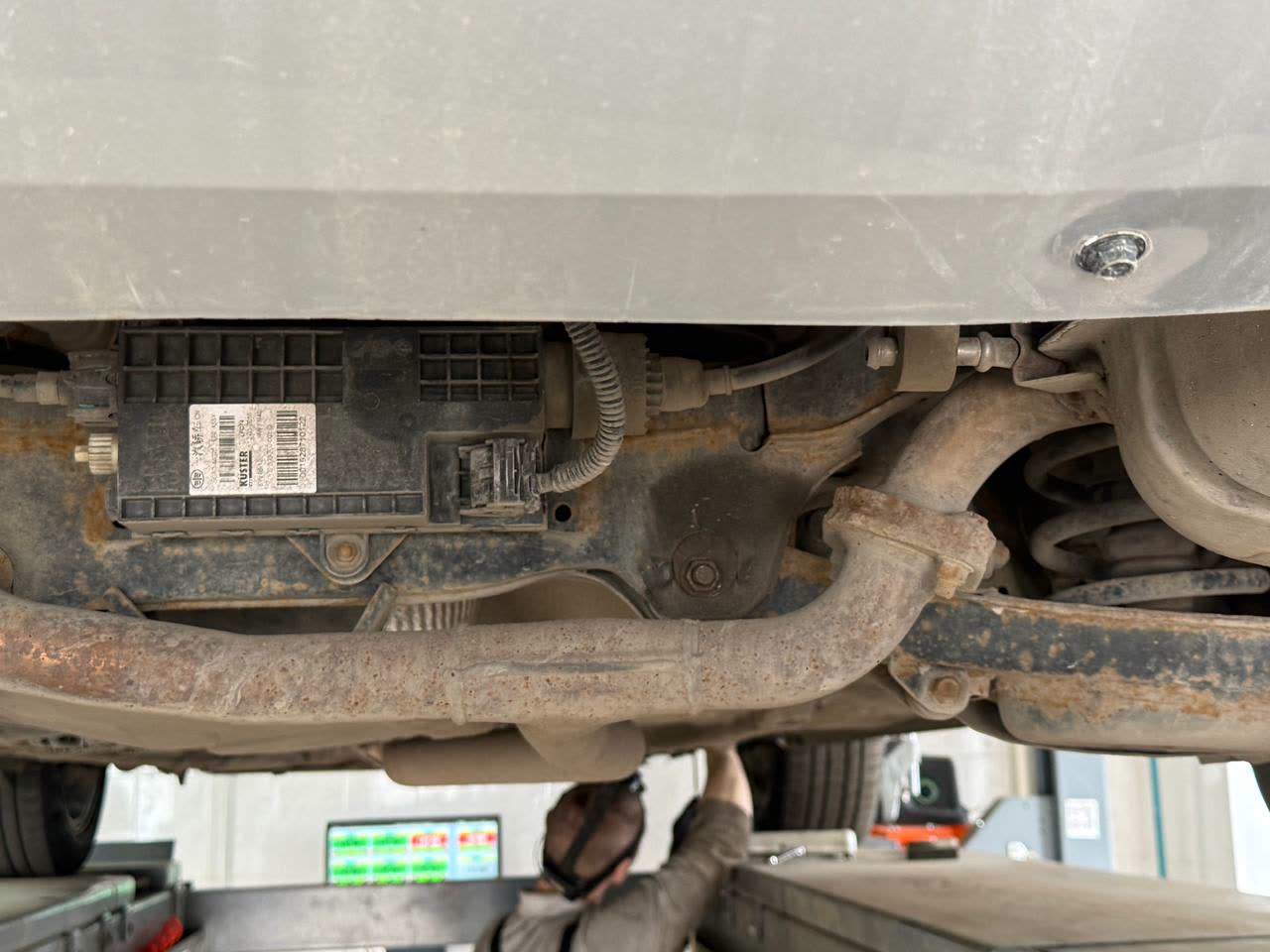 Photo showing the location of a rear suspension bushing on the X80, shared while discussing which Mazda-sourced silentblock fits which mount