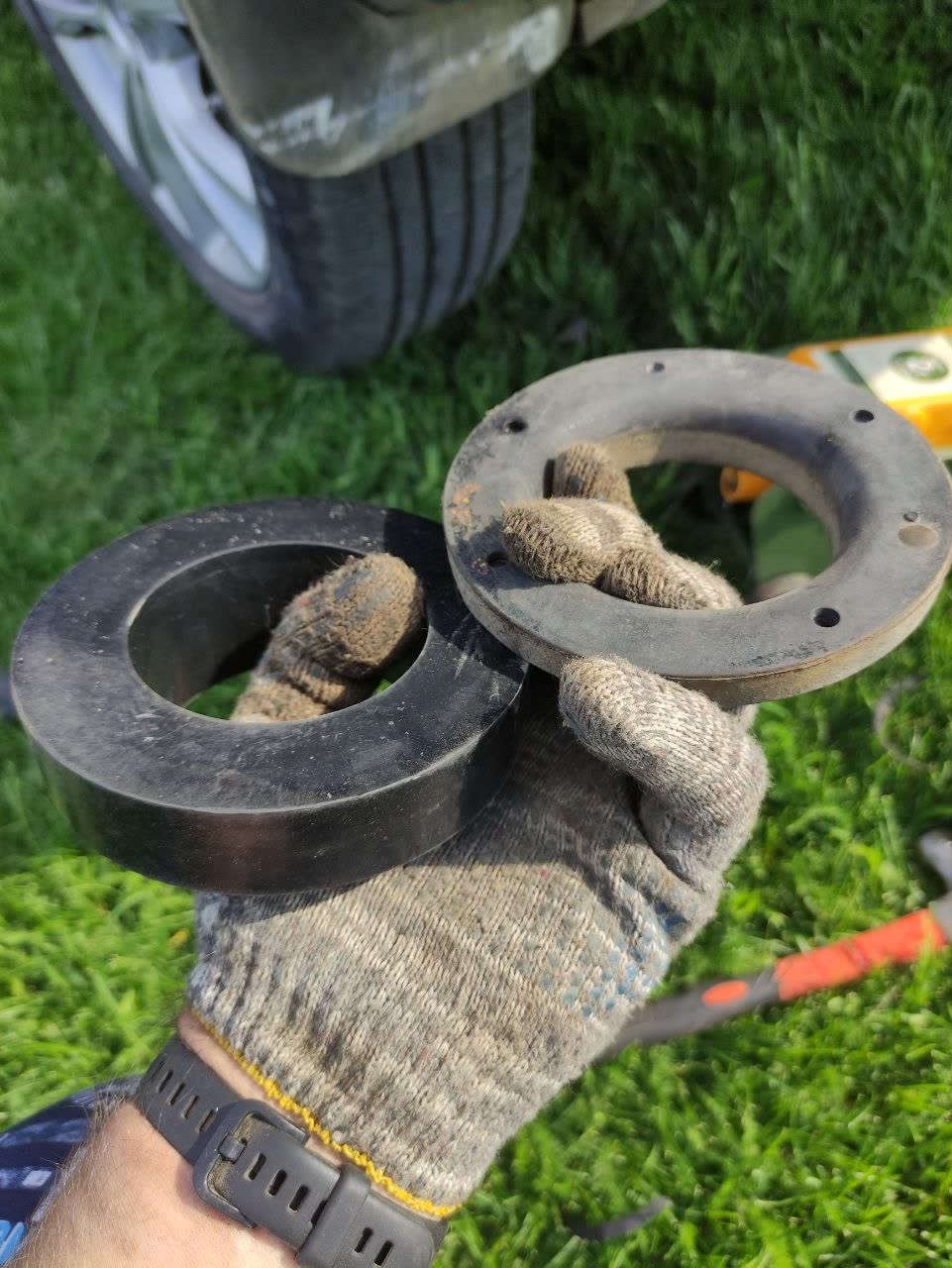 PTFE rear spacer with edge modifications cut/filed to clear the rubber mount