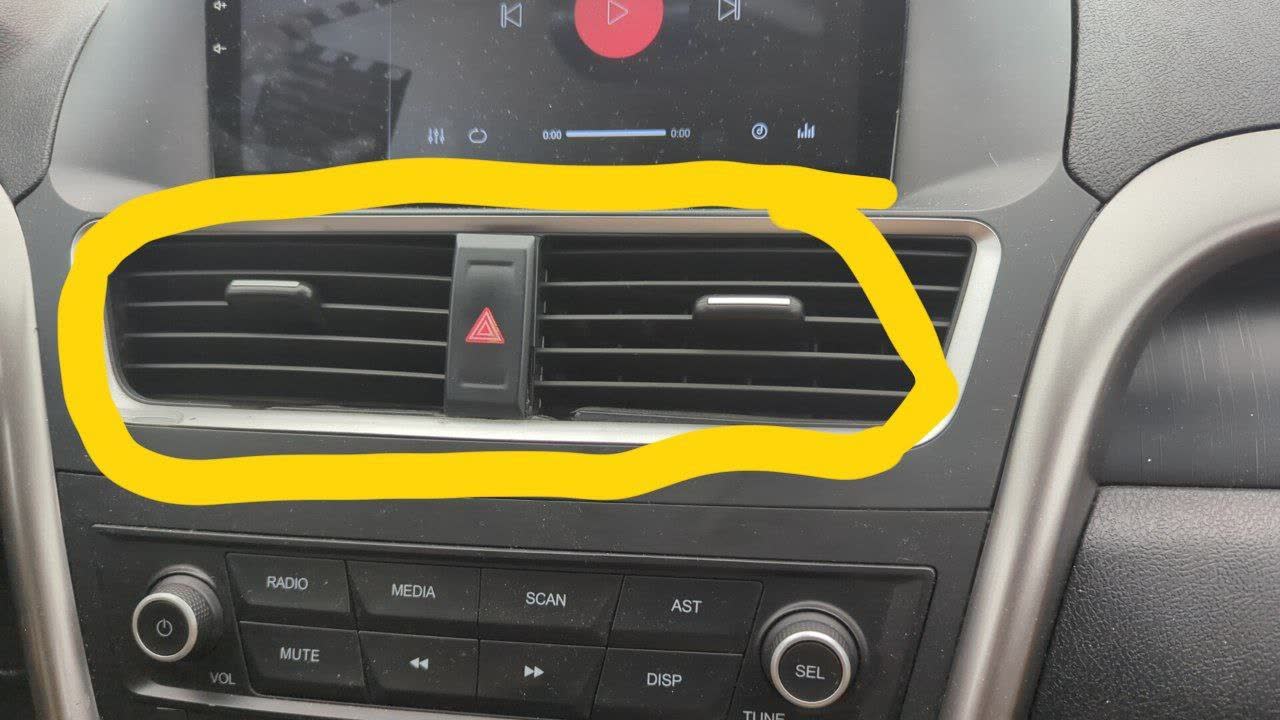 Restyle dashboard interior photo showing deflector assembly integrated with instrument-cluster monitor frame and vent slats