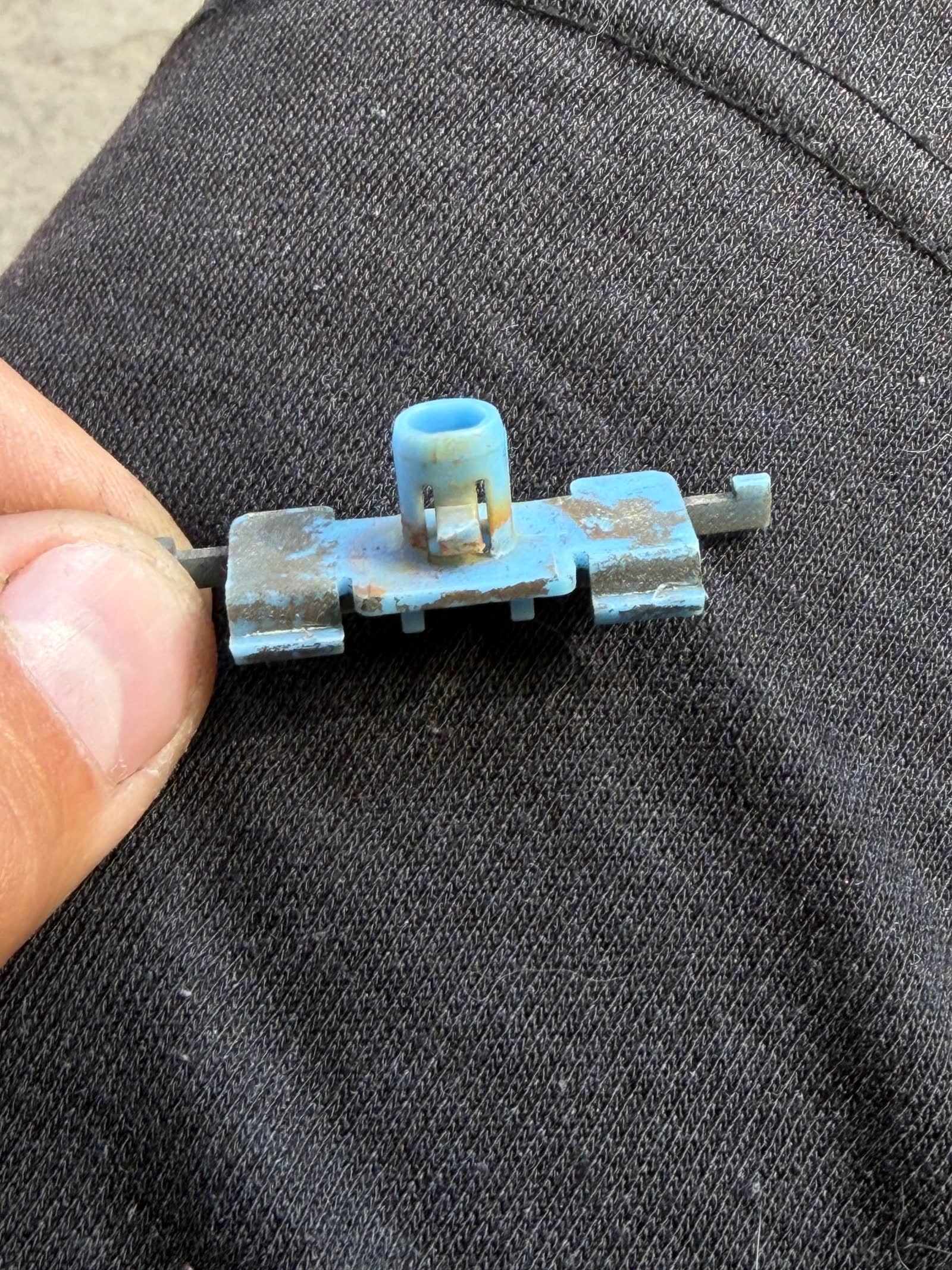 Rear chrome trim corrosion before treatment — rust spots visible under the trim