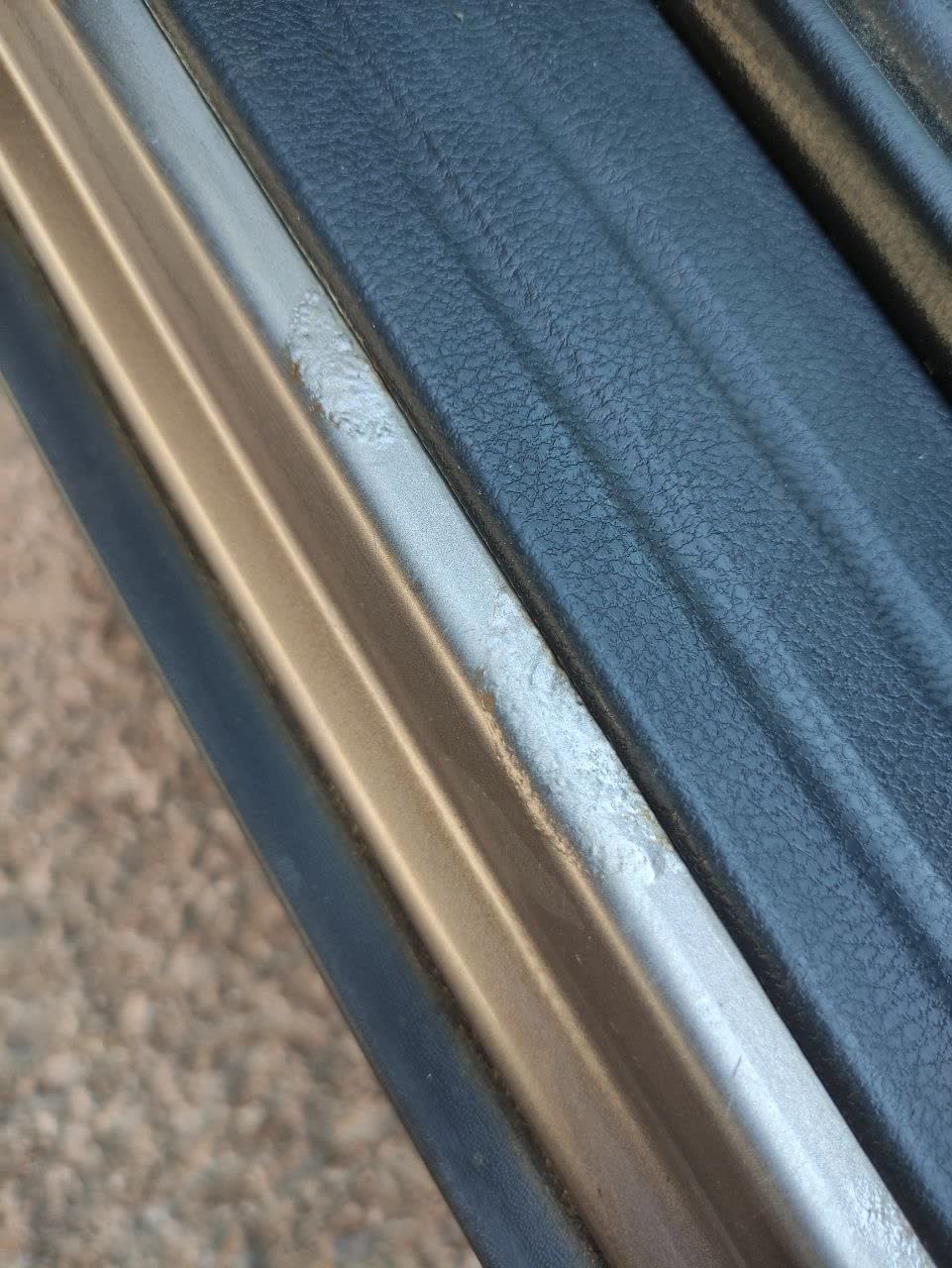 Photo of expanding corrosion bubble on the driver's door sill, 2019 model