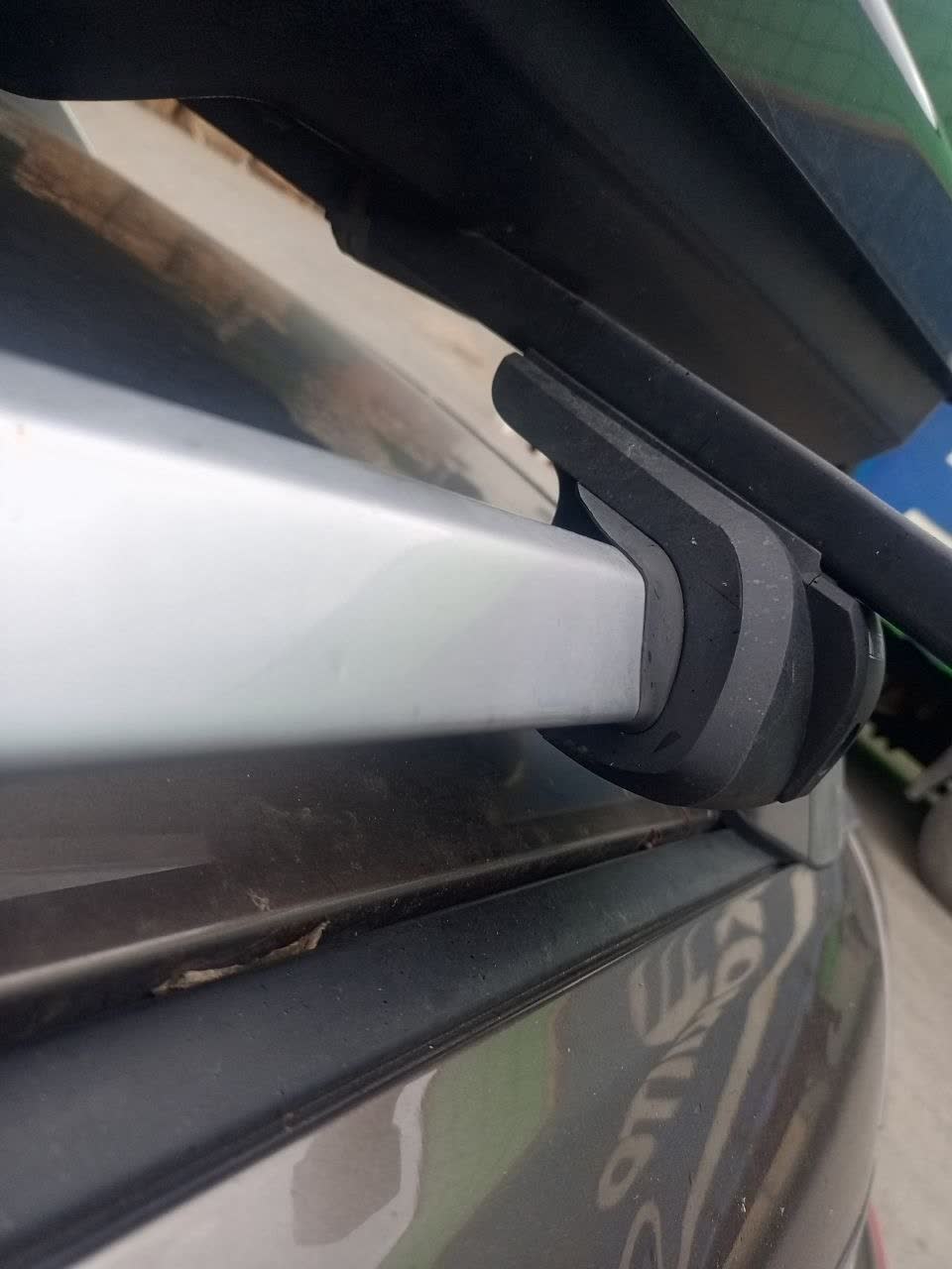 Installed Ozon-brand roof rack with black wing-shaped crossbars