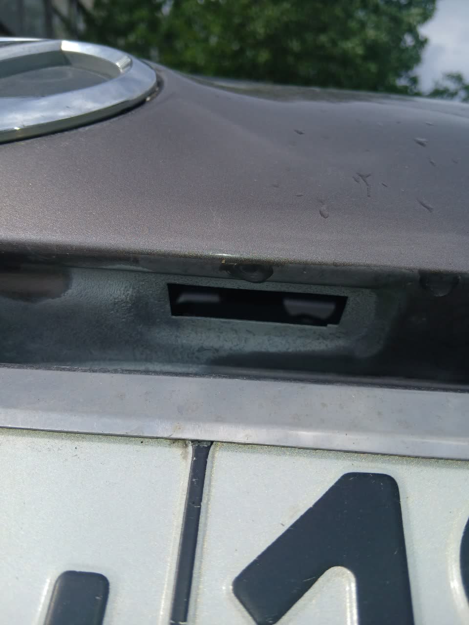 Hood and panel sections after hot zinc treatment, with treated corrosion areas visible before repaint